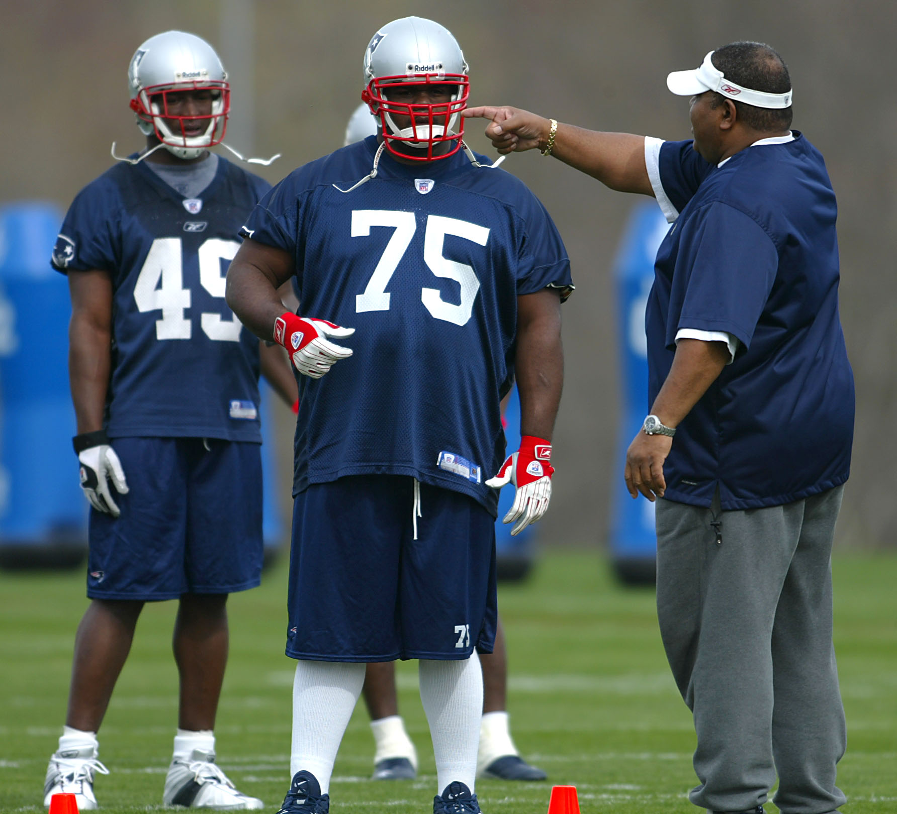 Romeo Crennel (right) coached Wilfork (75) his rookie season.