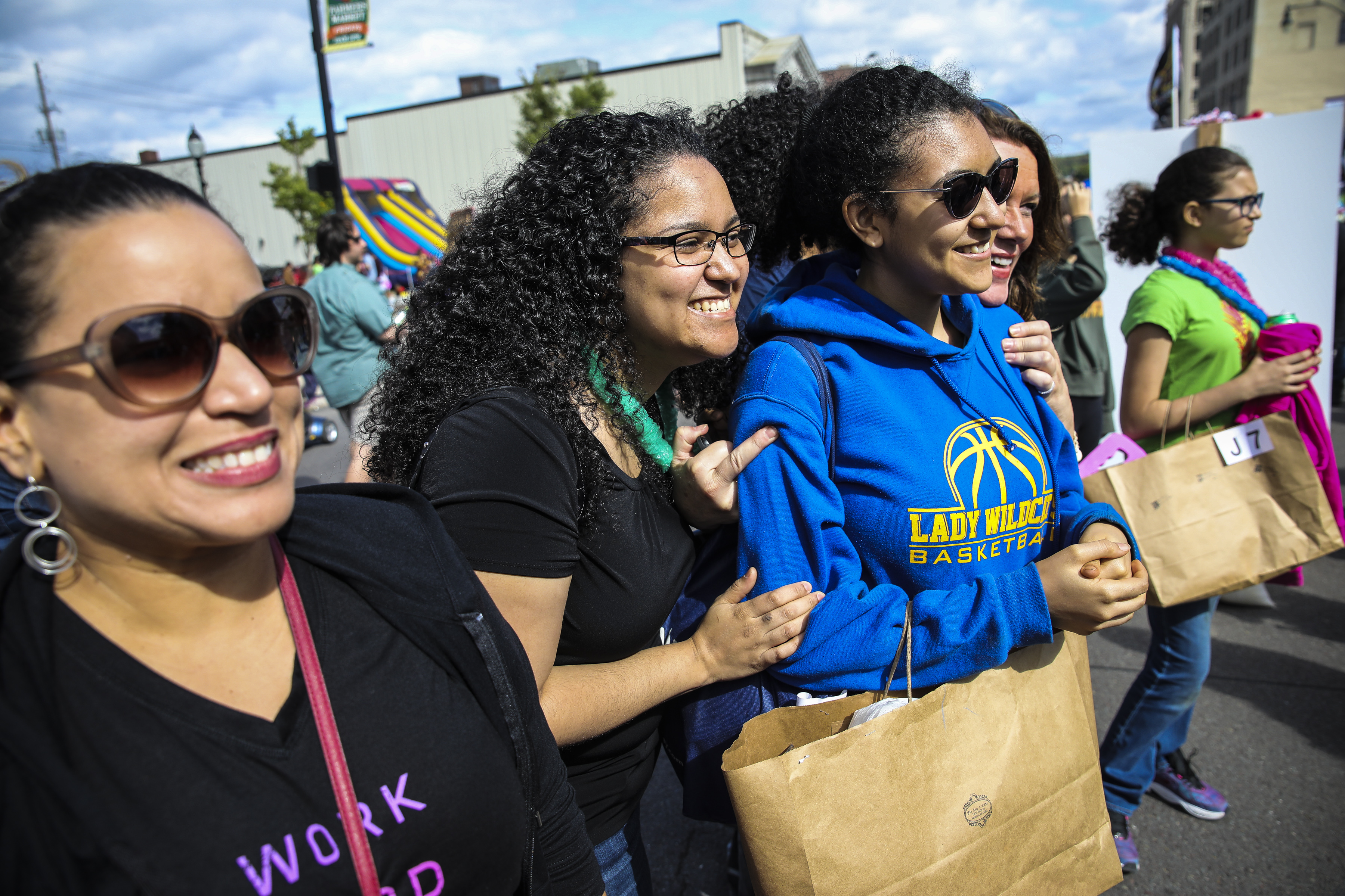 Penelope Rodriguez leaned into her daughter, Mariluz (center), after Mariluz competed in the art competition. Mariluz recently began college on a scholarship, where she plans to continue her artwork.