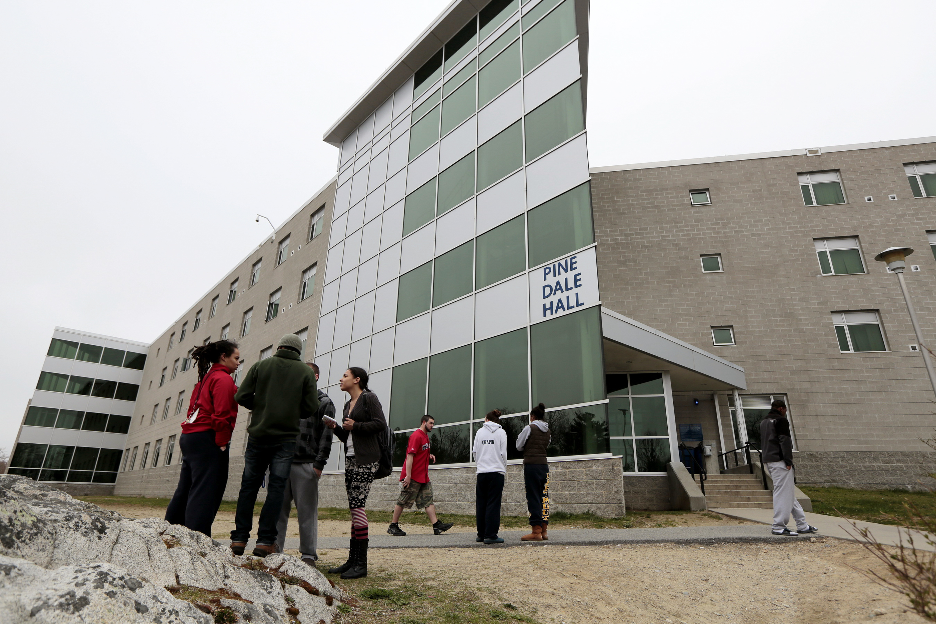 Students waited April 19 as officials examined the room where Dzhokhar Tsamaev lived.
