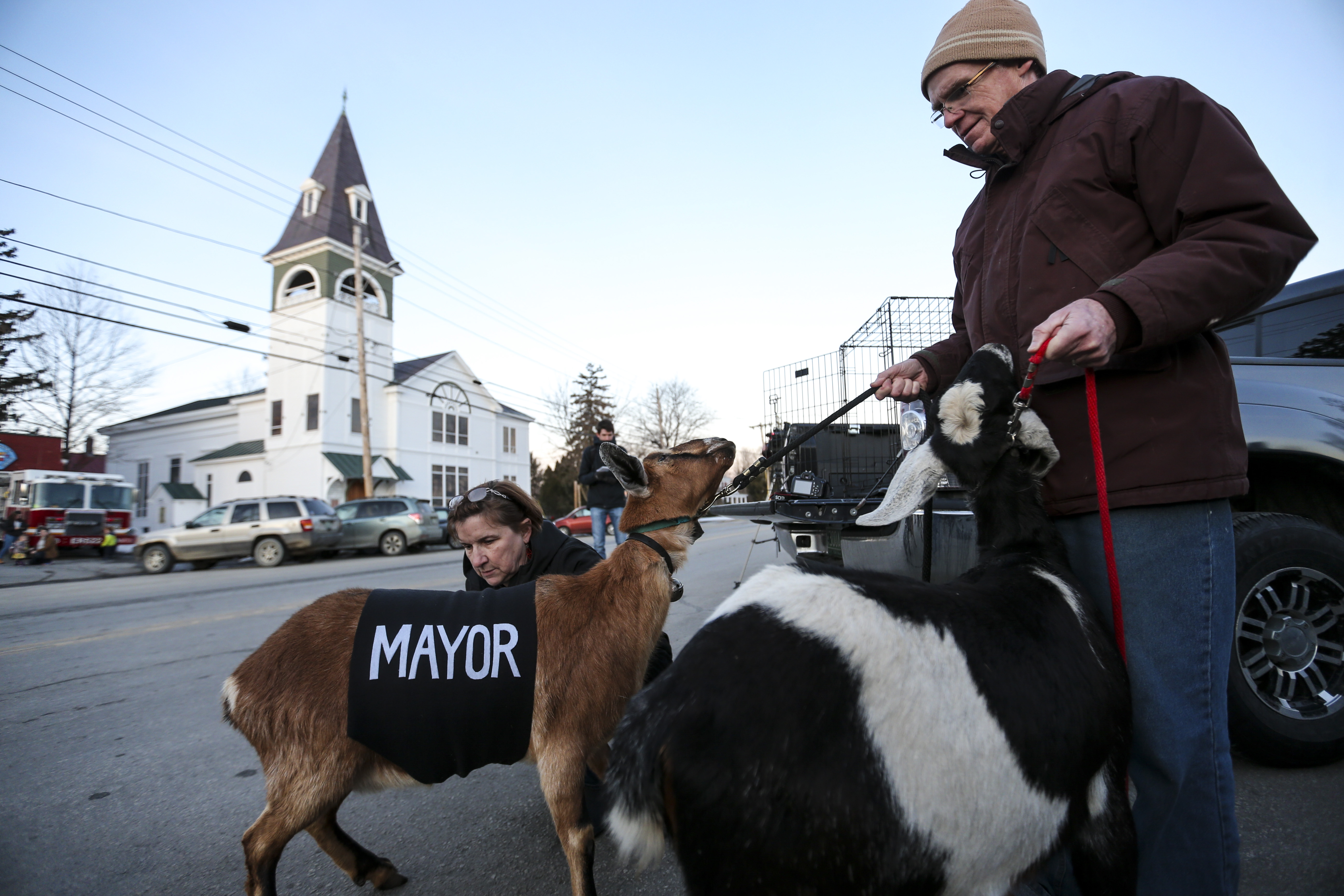 Sally Stanton, left, put a sash embroidered with the word "Mayor" on Lincoln before the official swearing-in ceremony.
