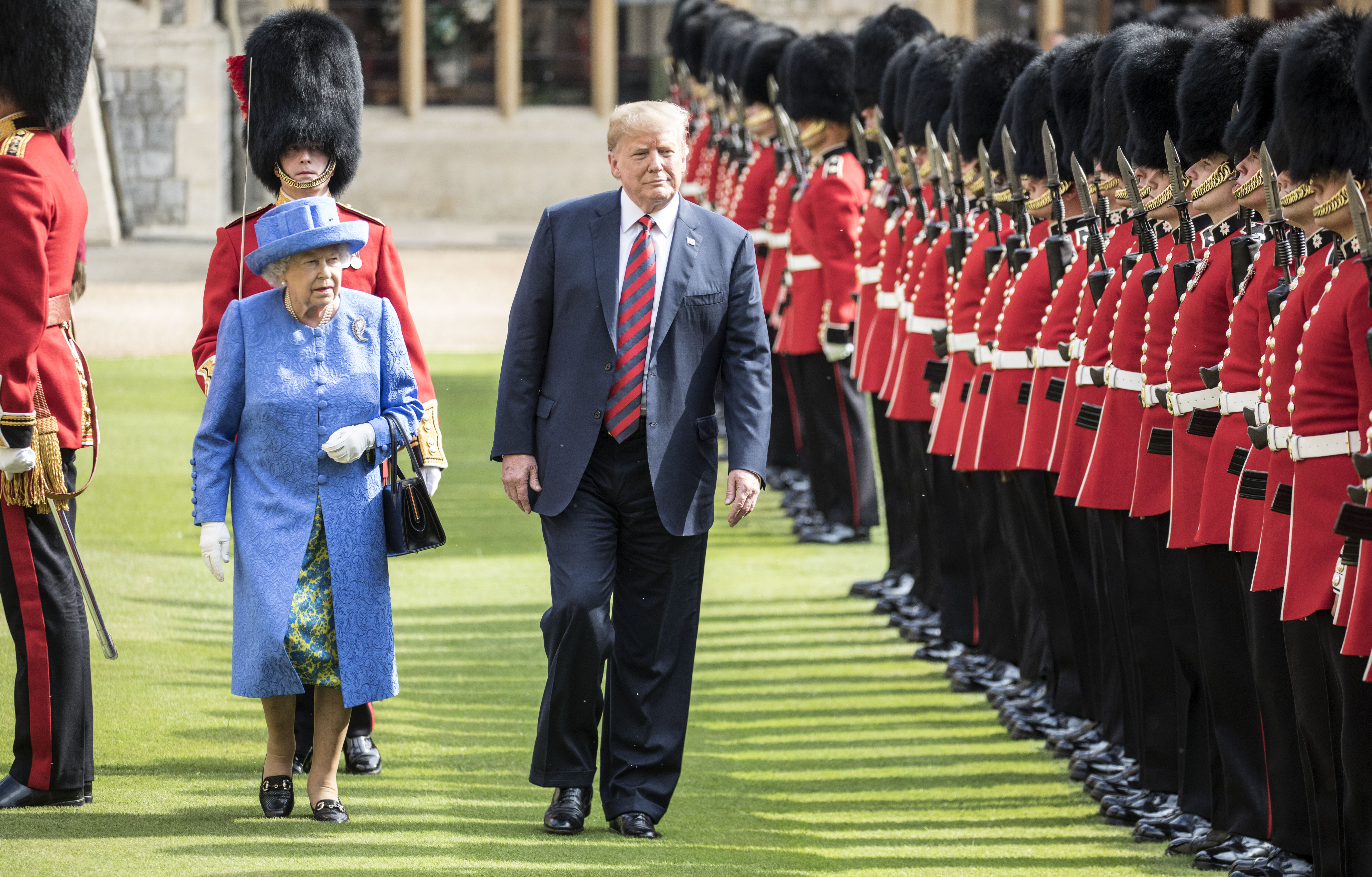 In a stranger-than-fiction twist, President Trump, shown here with Queen Elizabeth II on Friday, is slated to meet Monday with Russian President Vladimir Putin. Trump has called the Mueller investigation a “witch hunt.”