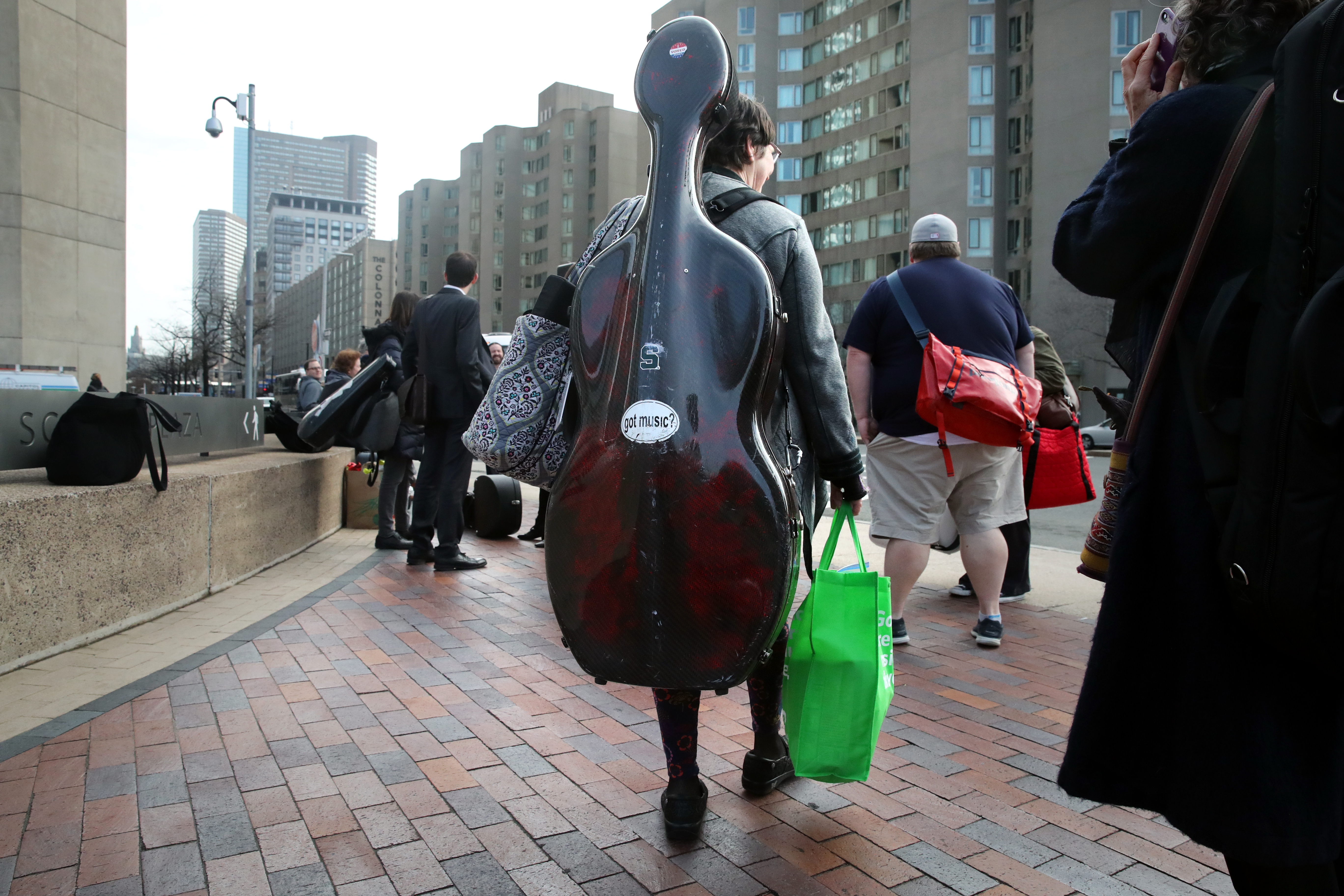 Sarah Freiberg carried her cello as she headed to board the bus to New York.