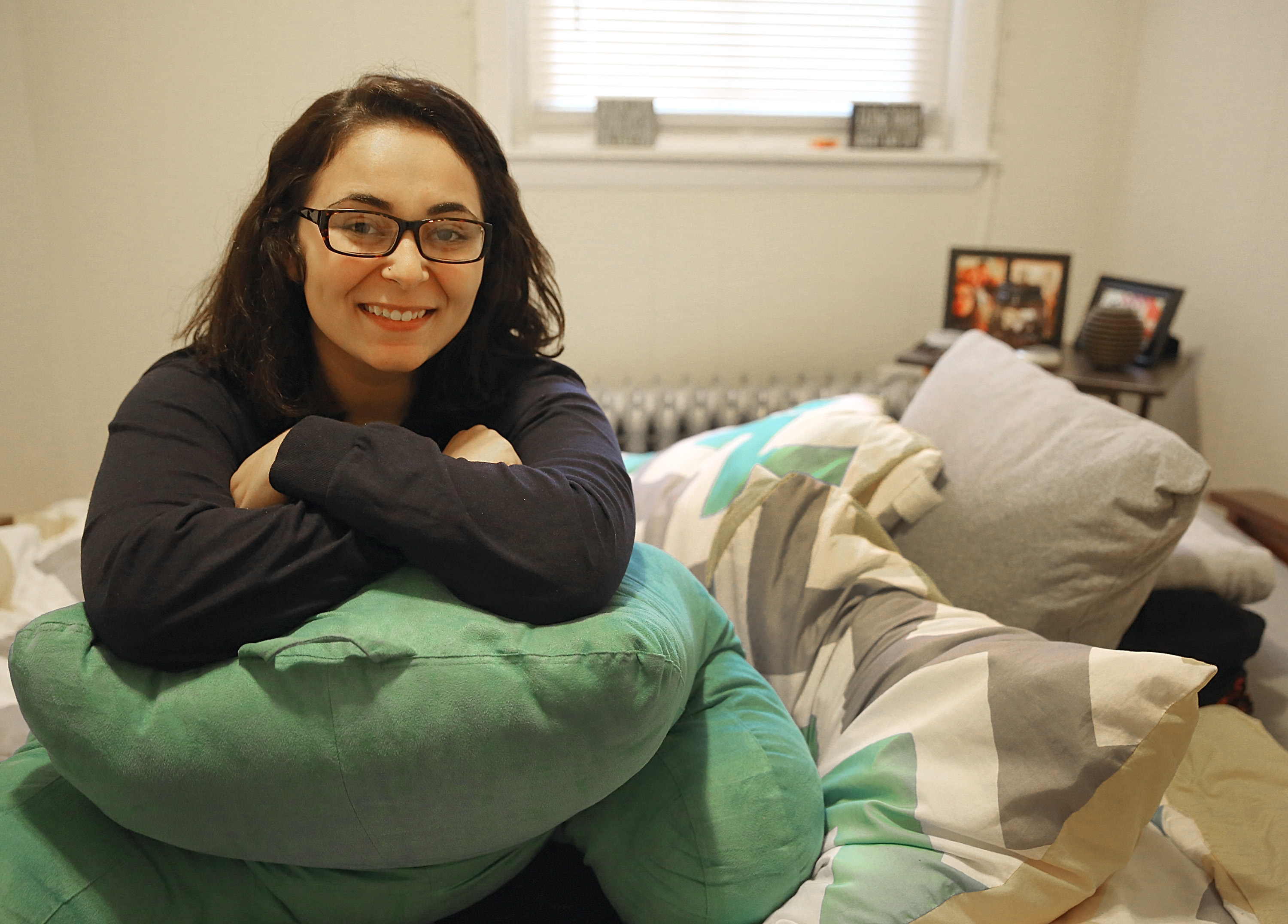 Brianna Silva, a junior at Suffolk University, is seen in the bedroom of her East Boston apartment on Monmouth Street.
