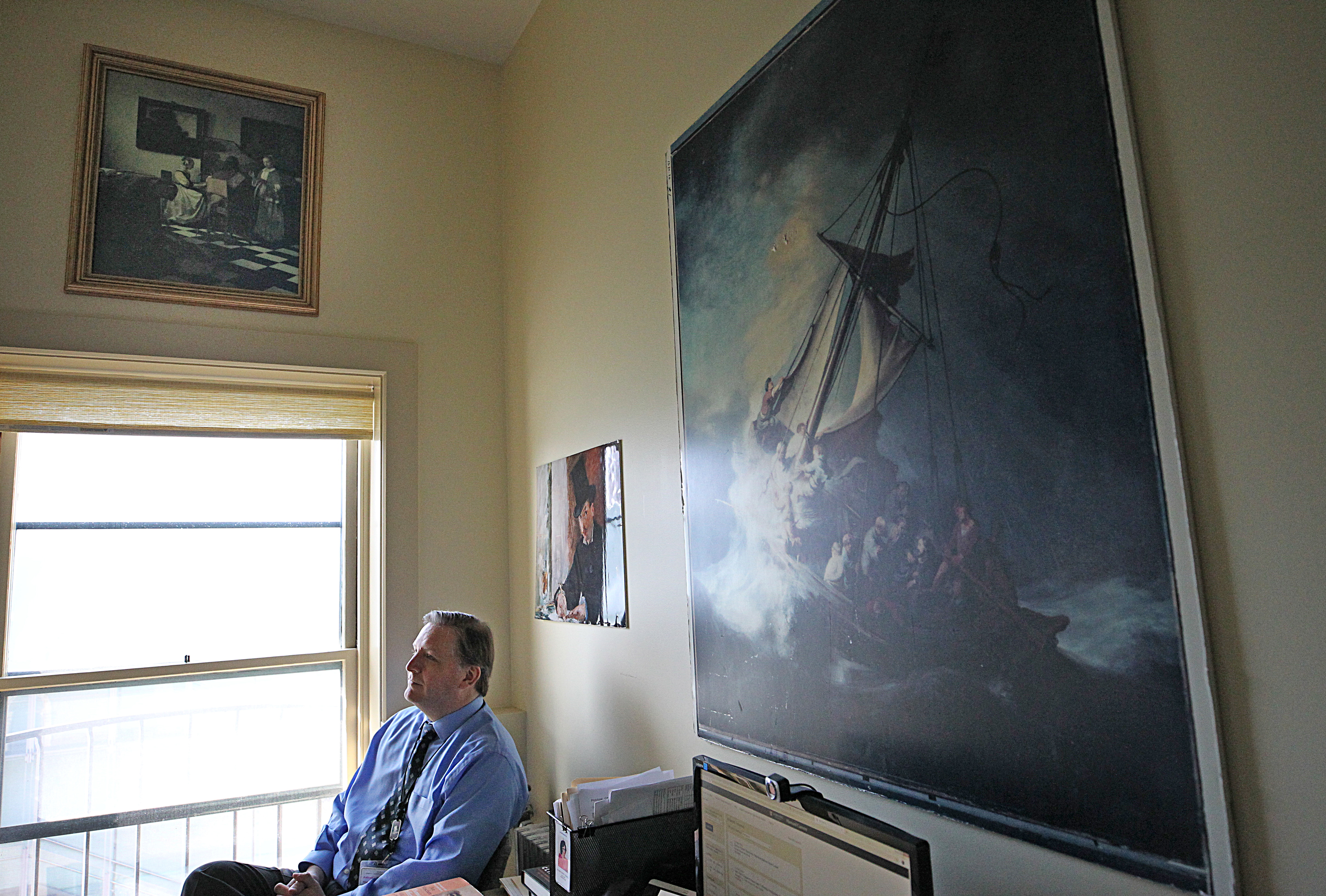 Boston, MA., 02/19/2019, Anthony Amore is the security director of the Isabella Stewart Gardner Museum in his office, which reflects his all-consuming quest to recover the masterpieces stolen decades ago. His office has reporductions of the the lost artwork, including a photograph of the painting The Storm on the Sea of Galilee by Rembrandt. Globe staff/Suzanne Kreiter