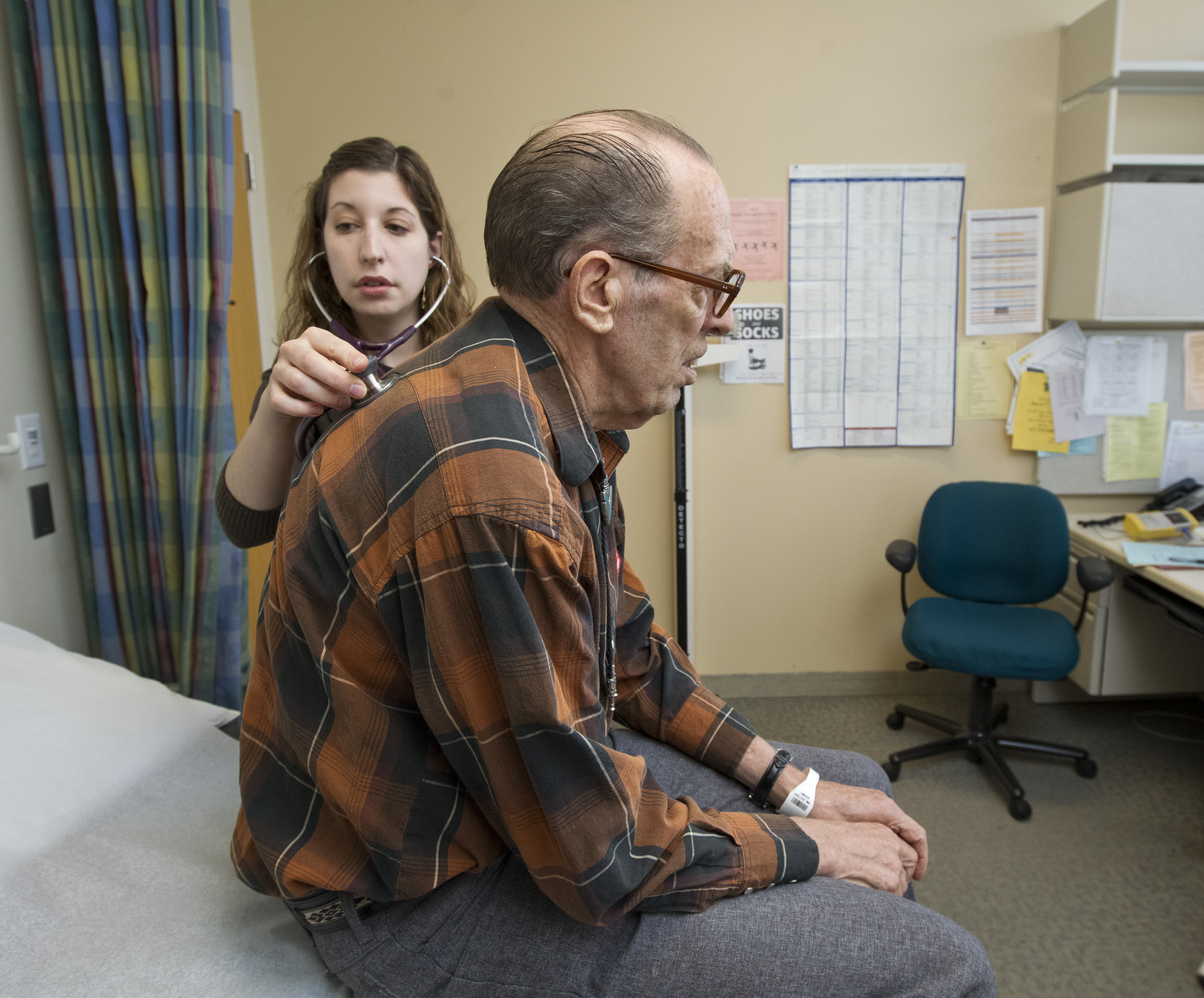 Dr. Elizabeth Brem checks Roger Jensen at Beth Israel Deaconess Medical Center. Diagnosed with lung cancer while hospitalized for pneumonia, Jensen participates in a program offering close follow-up care to Medicare patients at risk for frequent hospitalizations.
