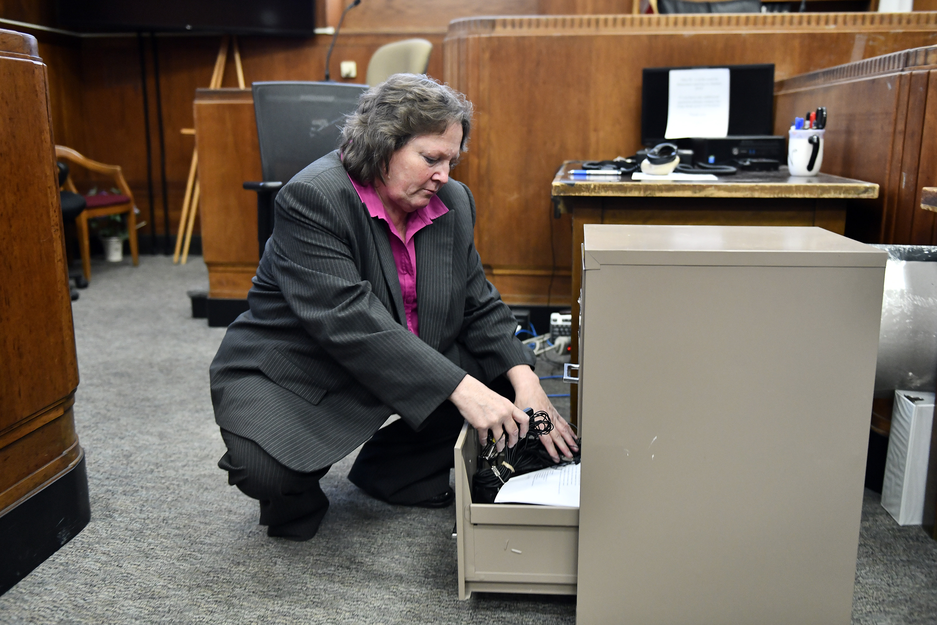 Court reporter Nancy King packed up the equipment she used to make courtroom transcripts in Suffolk Superior Court on her last day.