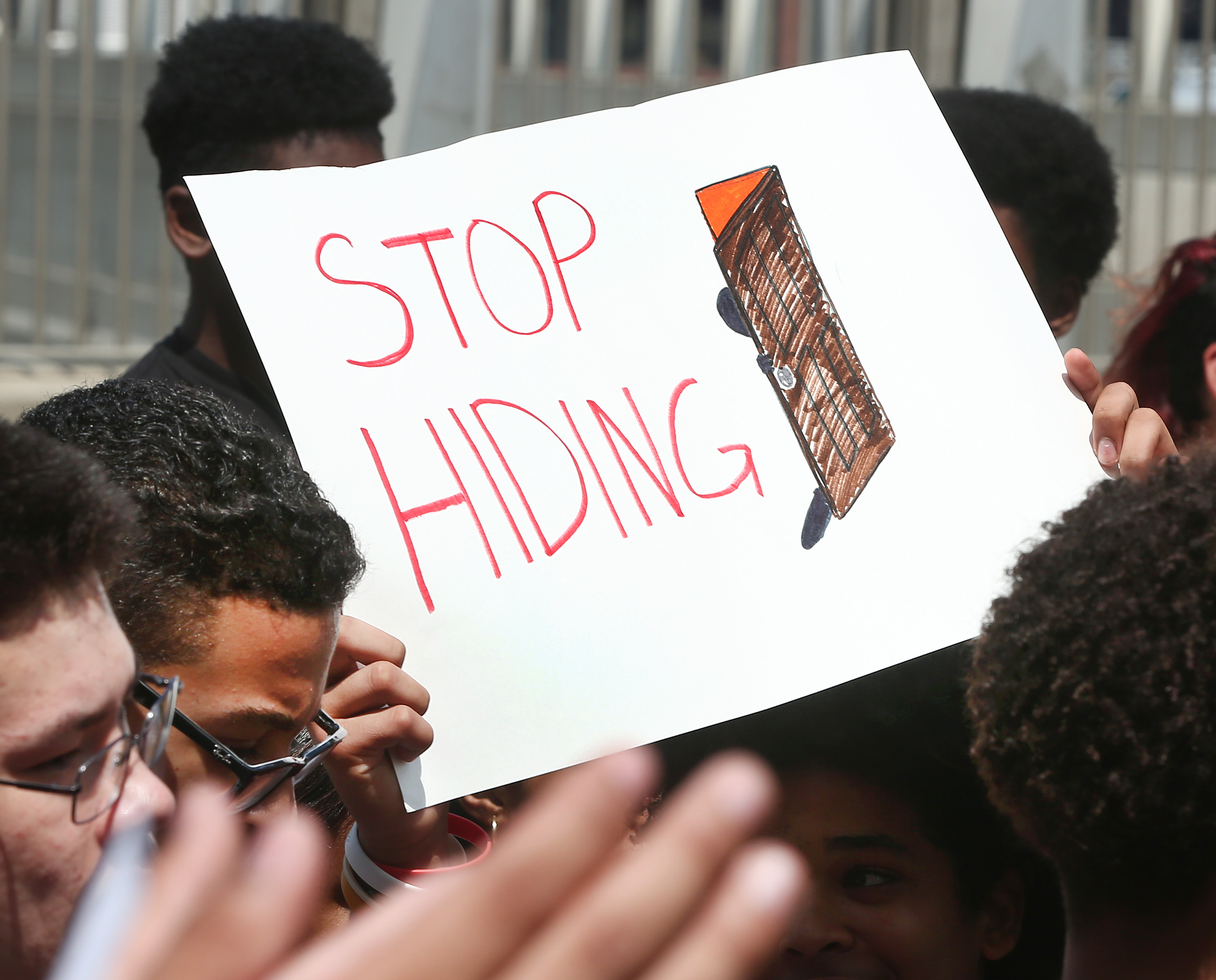 Members of the Hyde Square Task Force and their supporters held a sign referring to TD Garden owner Jeremy Jacobs at a protest Aug. 3 in front of the Garden.