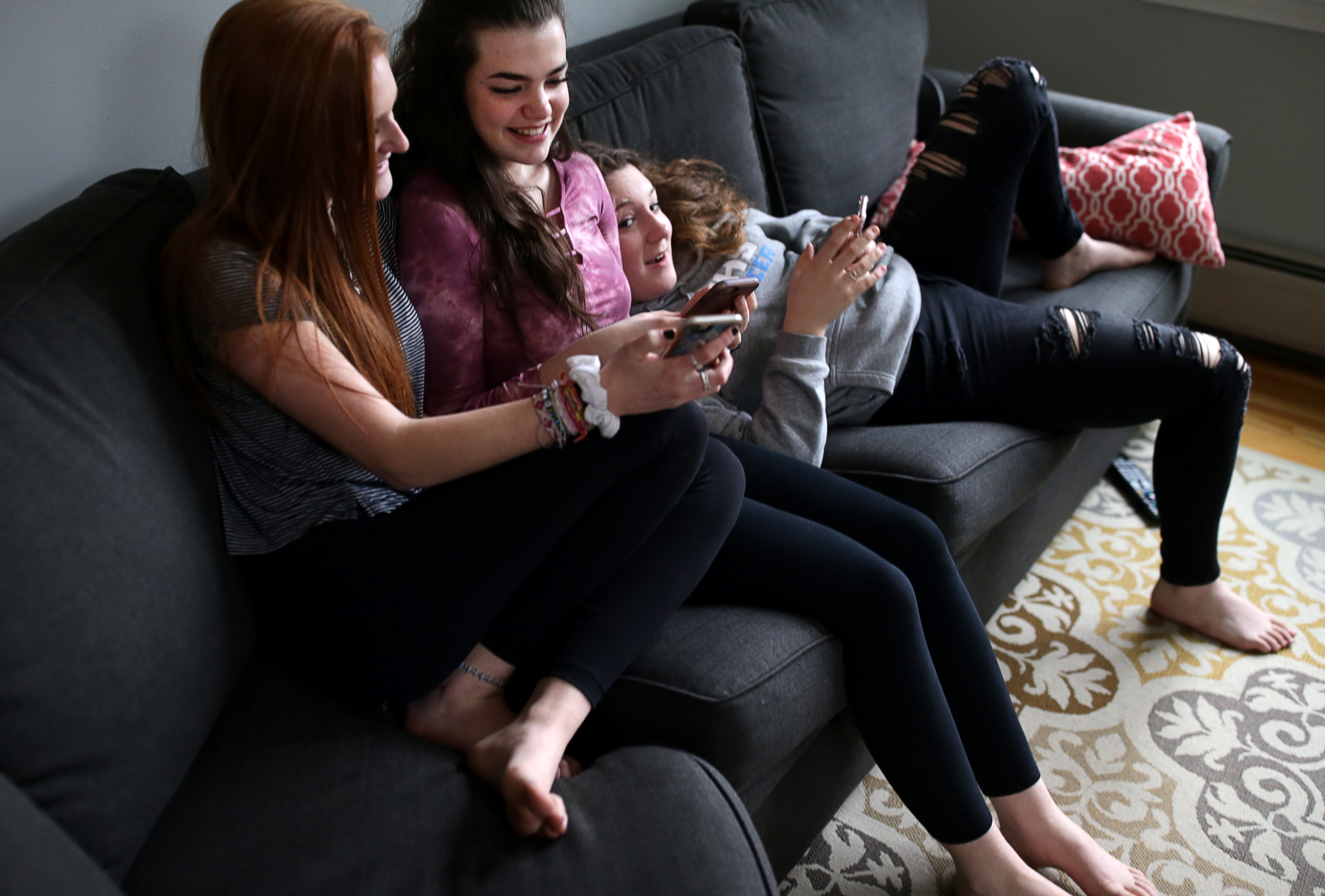 (From left) Olivia Goebel, Izzy Netherwood, and Ava Caporizzo, who became friends at the South Shore YMCA’s Camp Hayward, spend time together in Franklin.