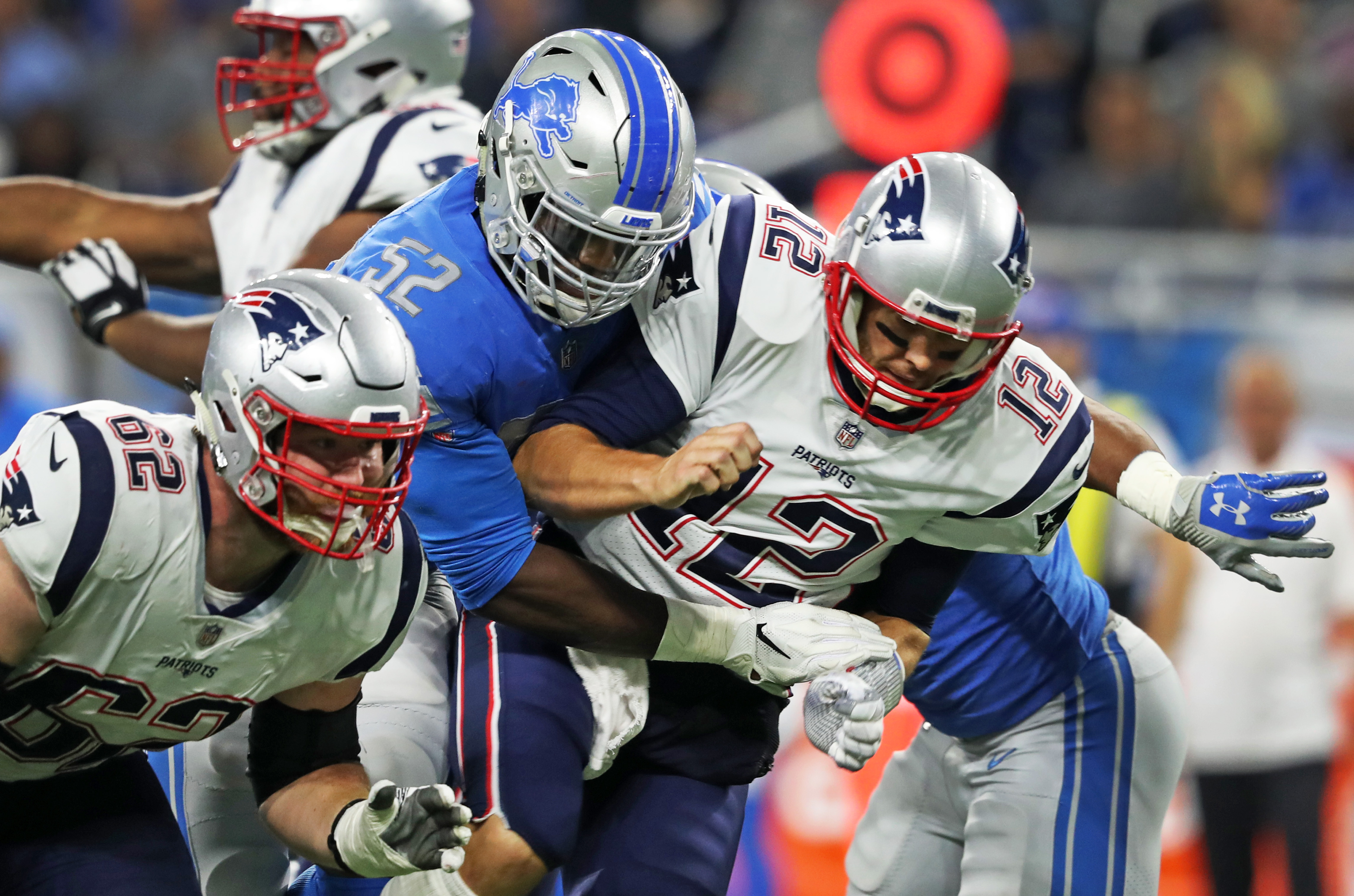Tom Brady is hit by the Christian Jones after releasing a second quarter pass.