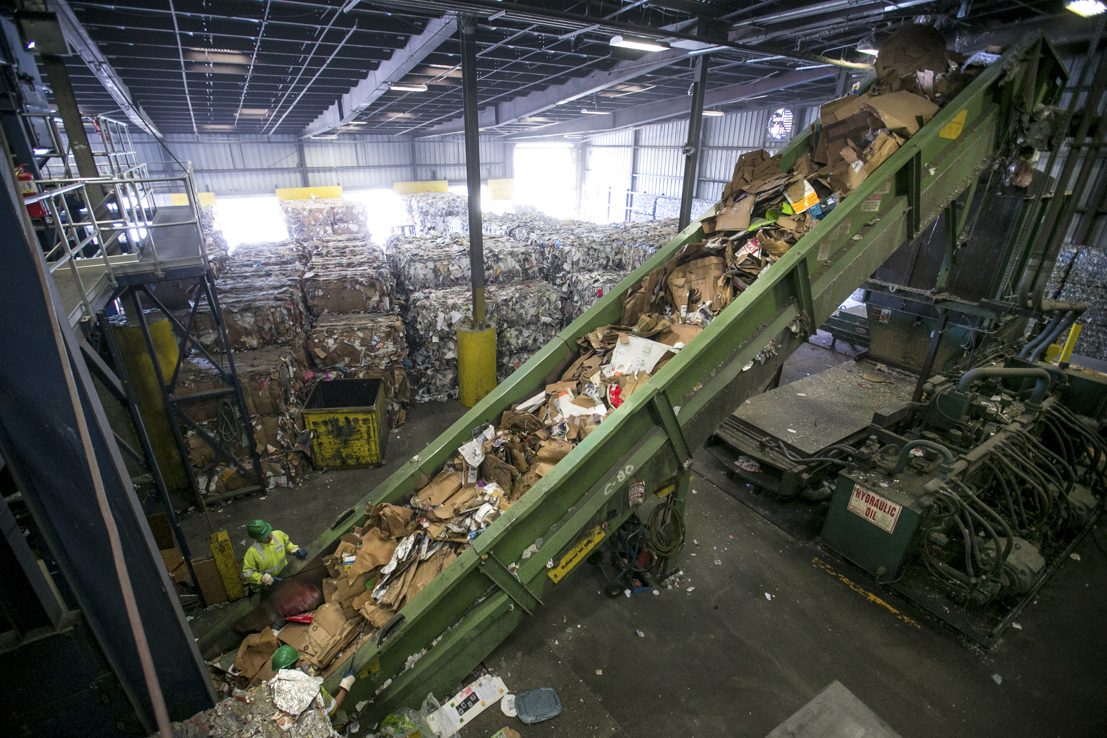 At Casella, cardboard is compressed into bales; paper from single-stream initiatives is notoriously contaminated with trash and other recyclables.