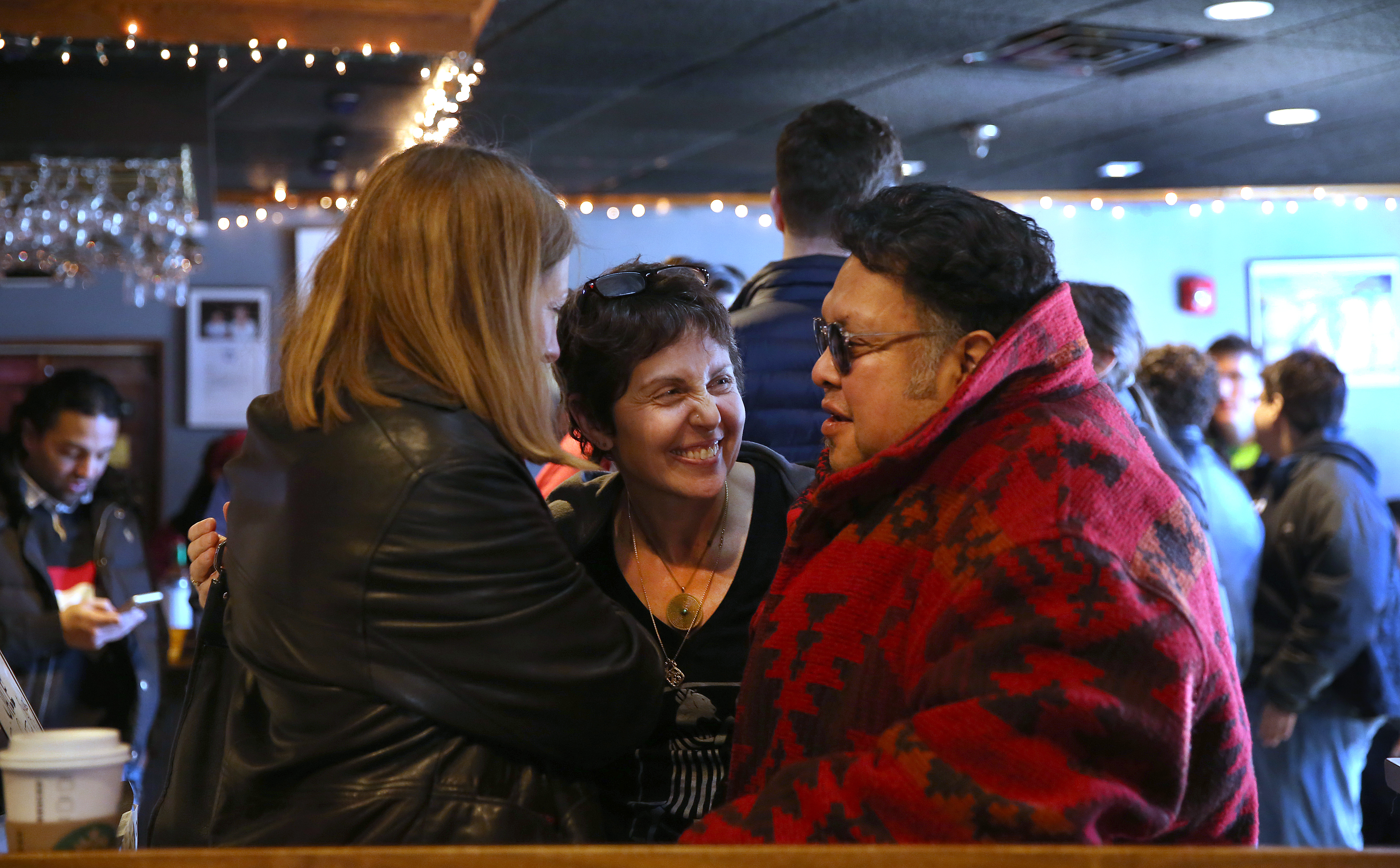 Johnny D’s owner Carla DeLellis (center) chatting with patrons Lisa McGinnis and her husband, Michael Soria, during the jazz brunch.
