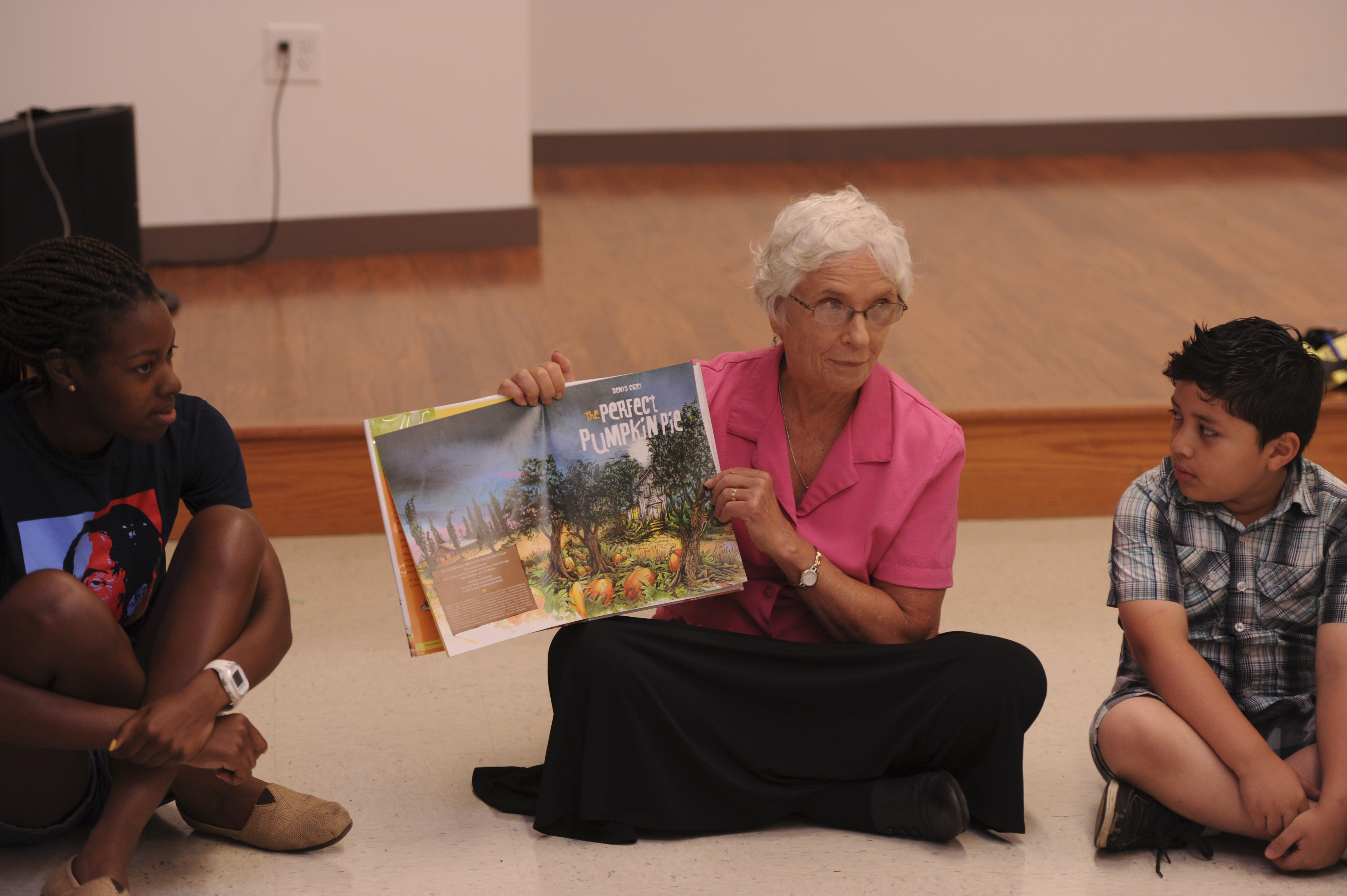 State Senator Patricia Jehlen, a Somerville Democrat, reads to a class.