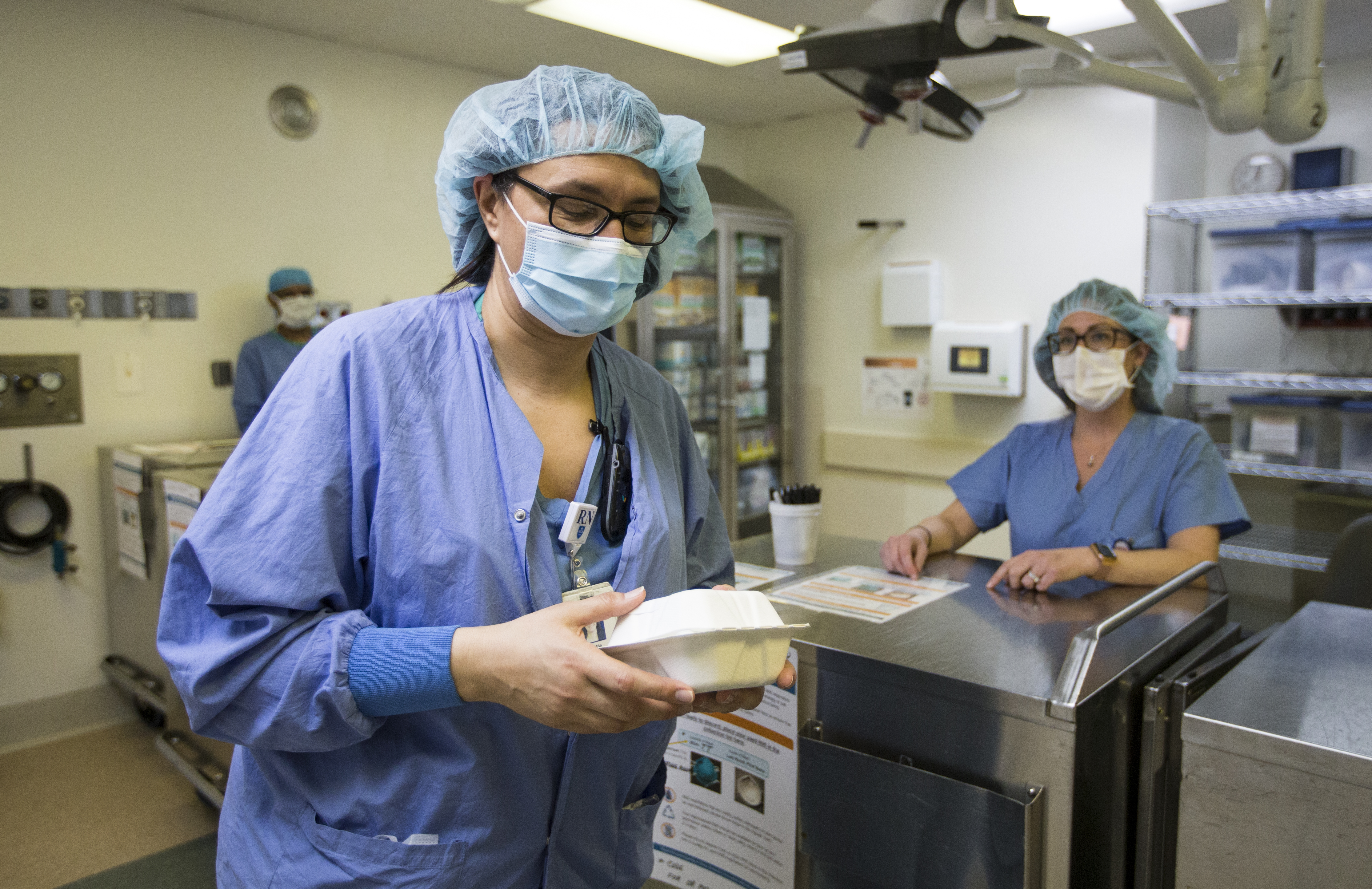 Melissa Mattola-Kiatos double-checked the name on her N95 mask that was cleaned by Battelle.