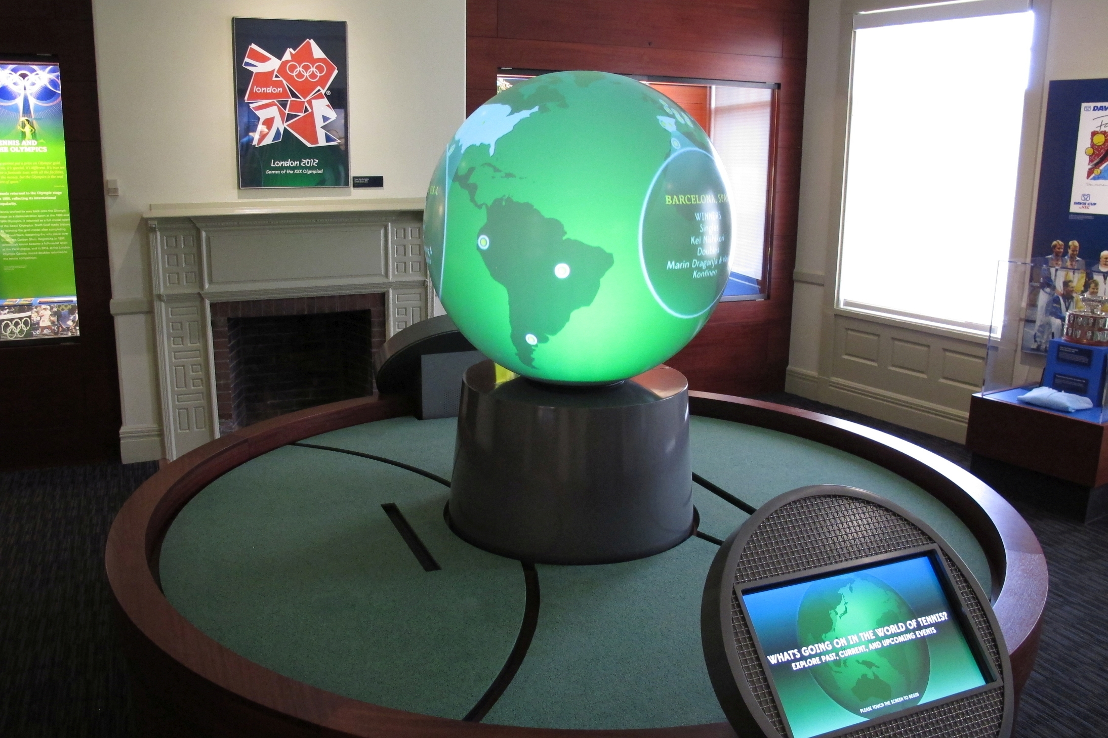 A touch-screen and a globe let visitors track tennis everywhere from the International Tennis Hall of Fame and Museum.