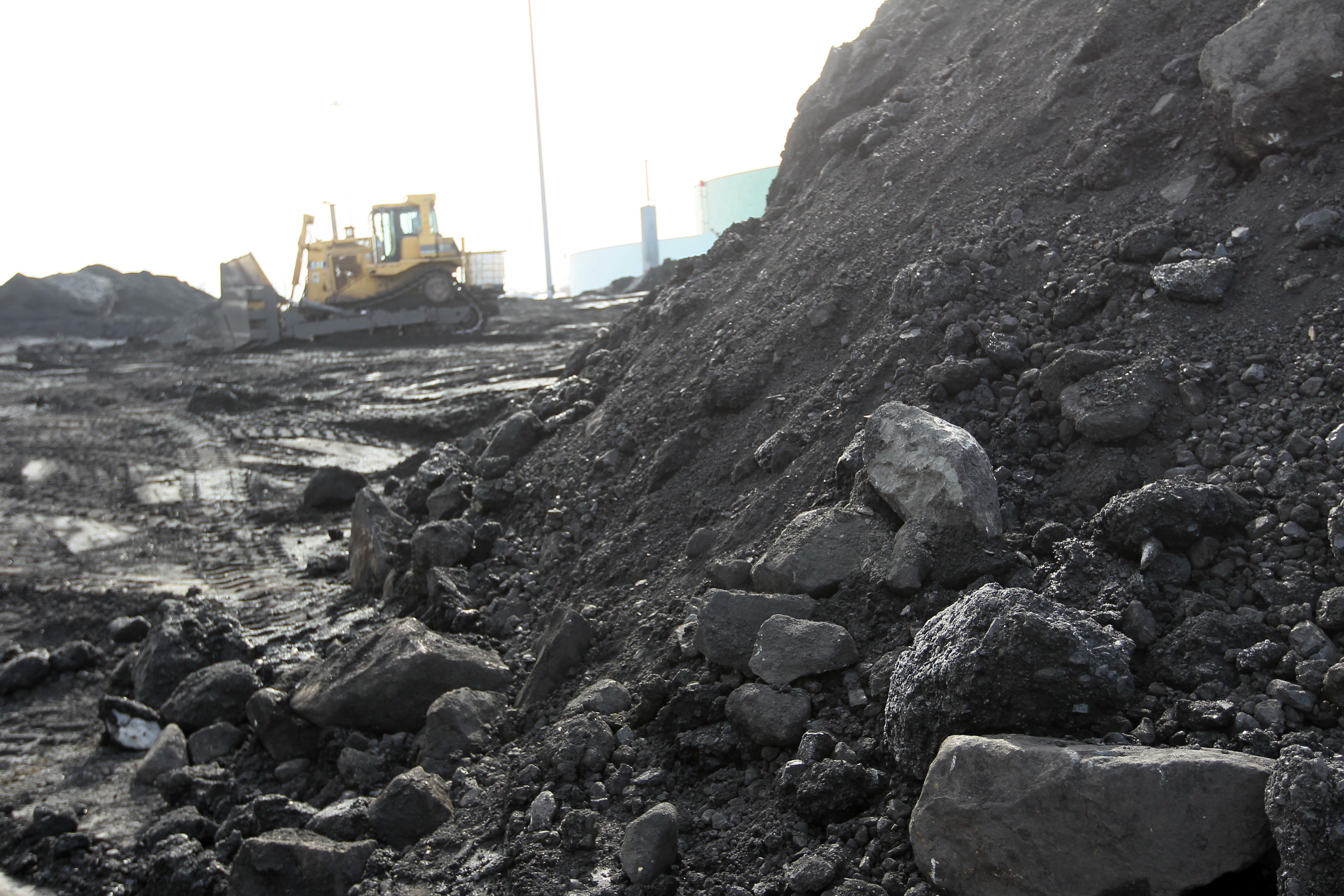 The coal pile at Salem Harbor station is shrinking as the plant’s closing nears.