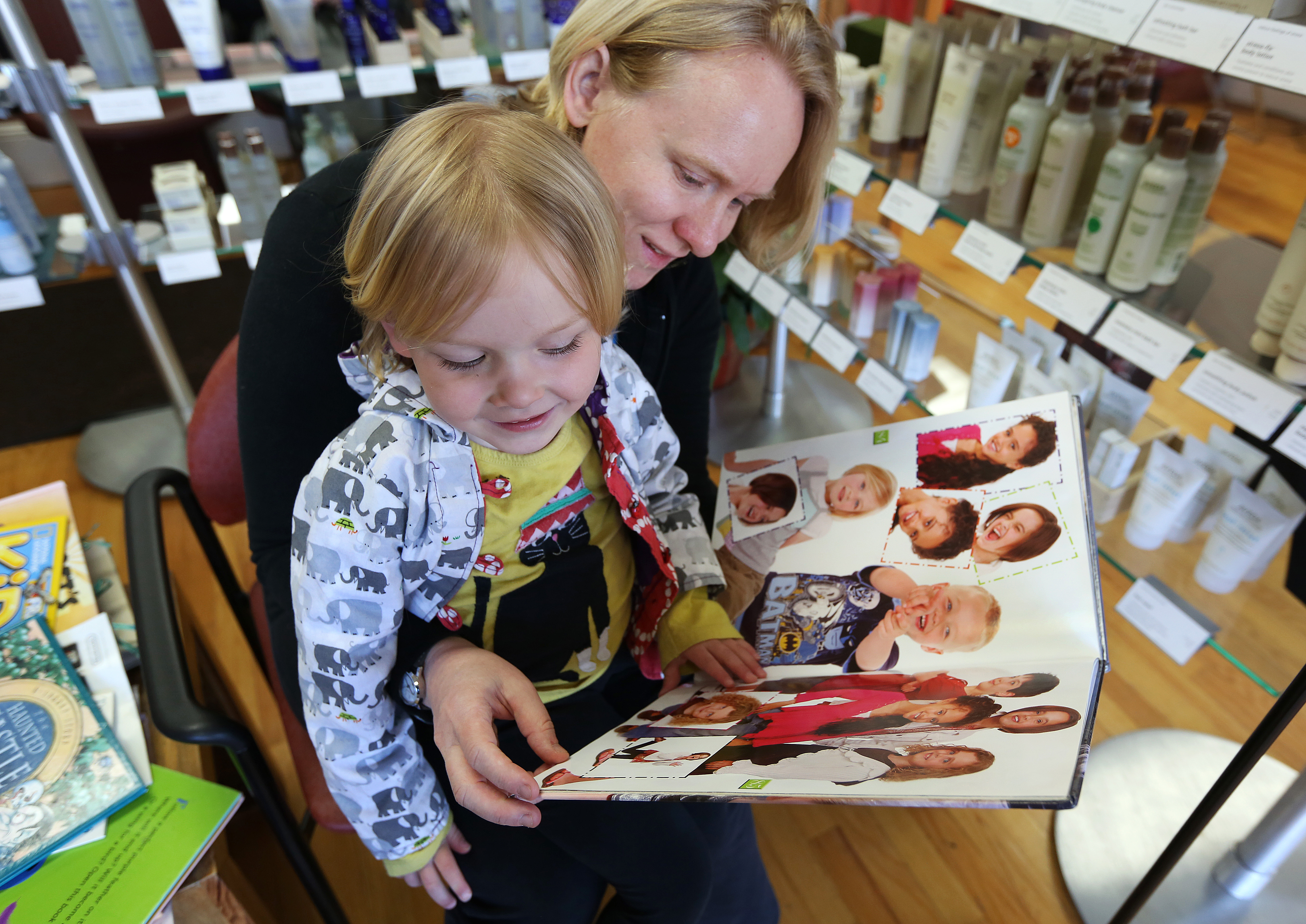 Pictured, a mom and daughter visit a salon. Above, a playground sits along so-called doctors’ row.