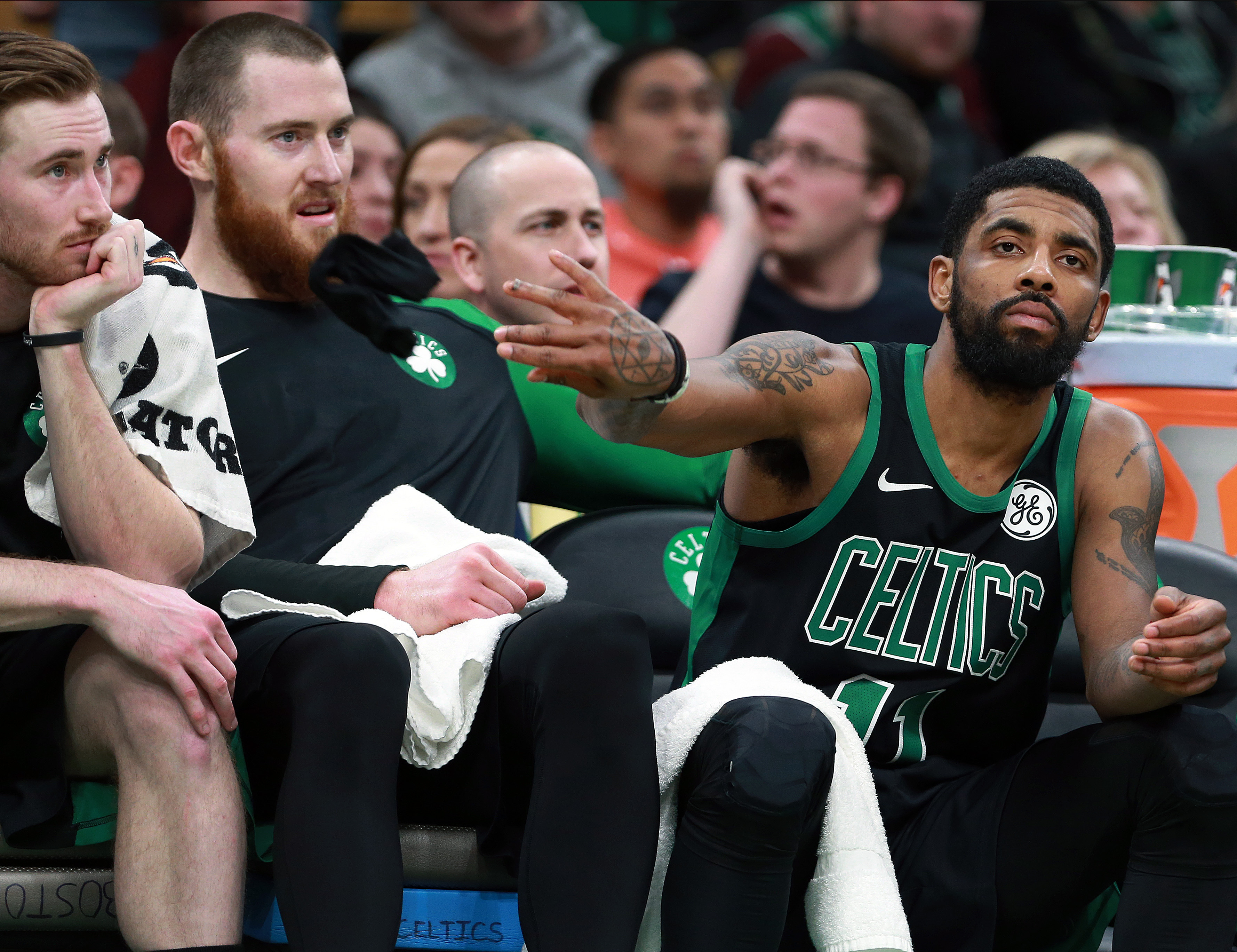 Gordon Hayward (left) and Aron Baynes and Kyrie Irving can’t mask their disappointment at Sunday’s loss.