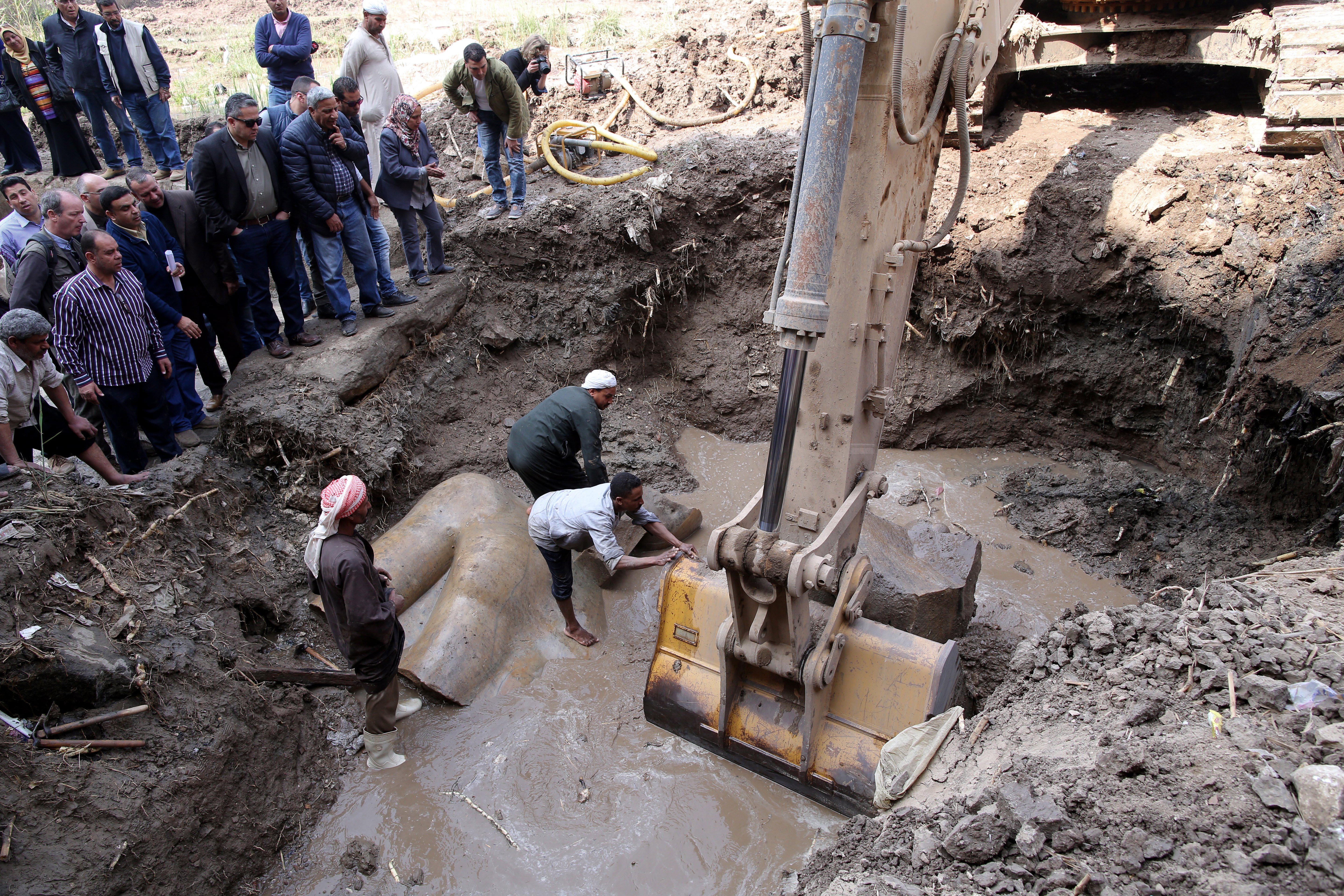 Heavy equipment was used to remove part of the statue from the ground.