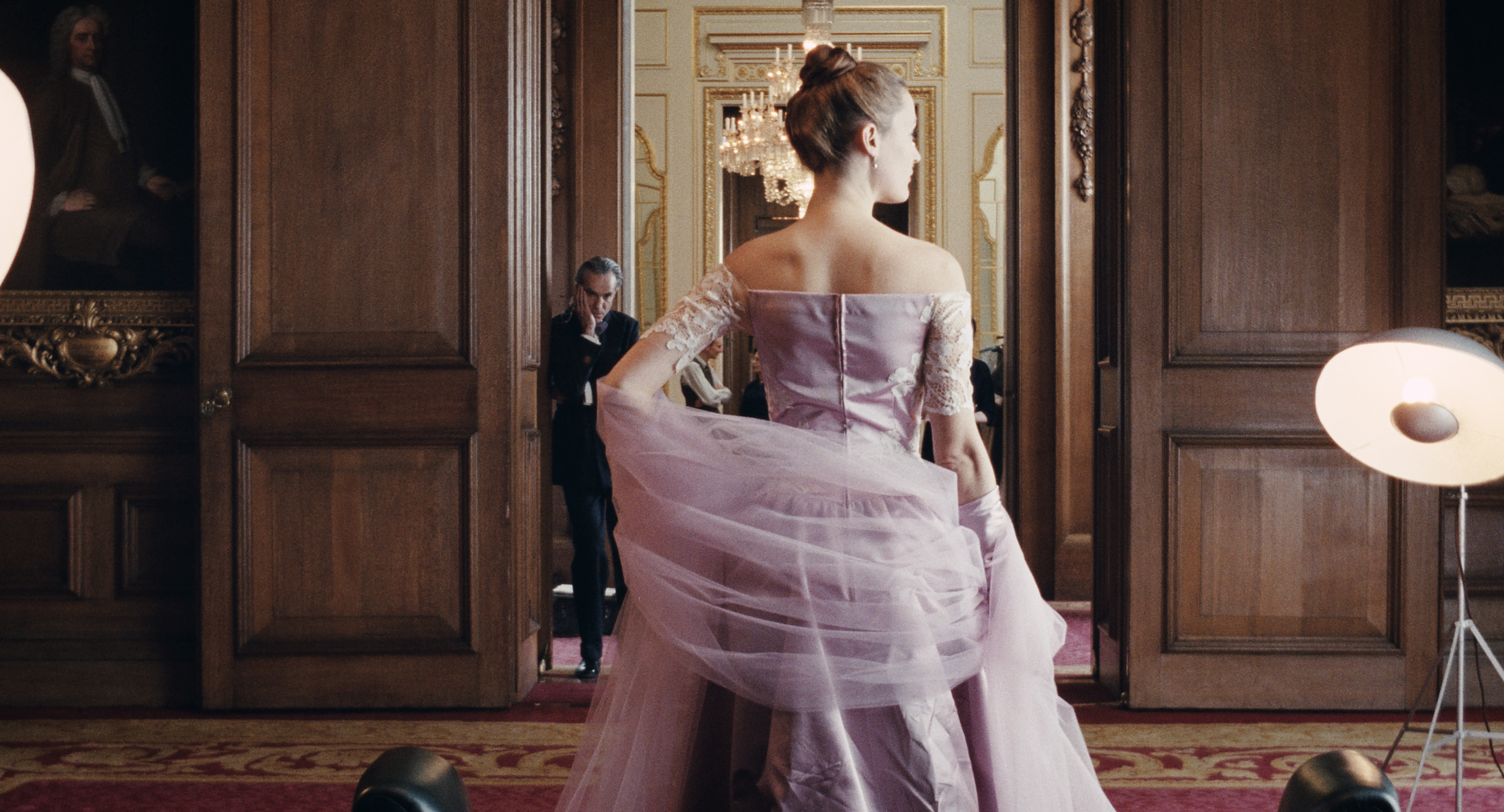 Vicky Krieps in "Phantom Thread," with Daniel Day-Lewis in the background.