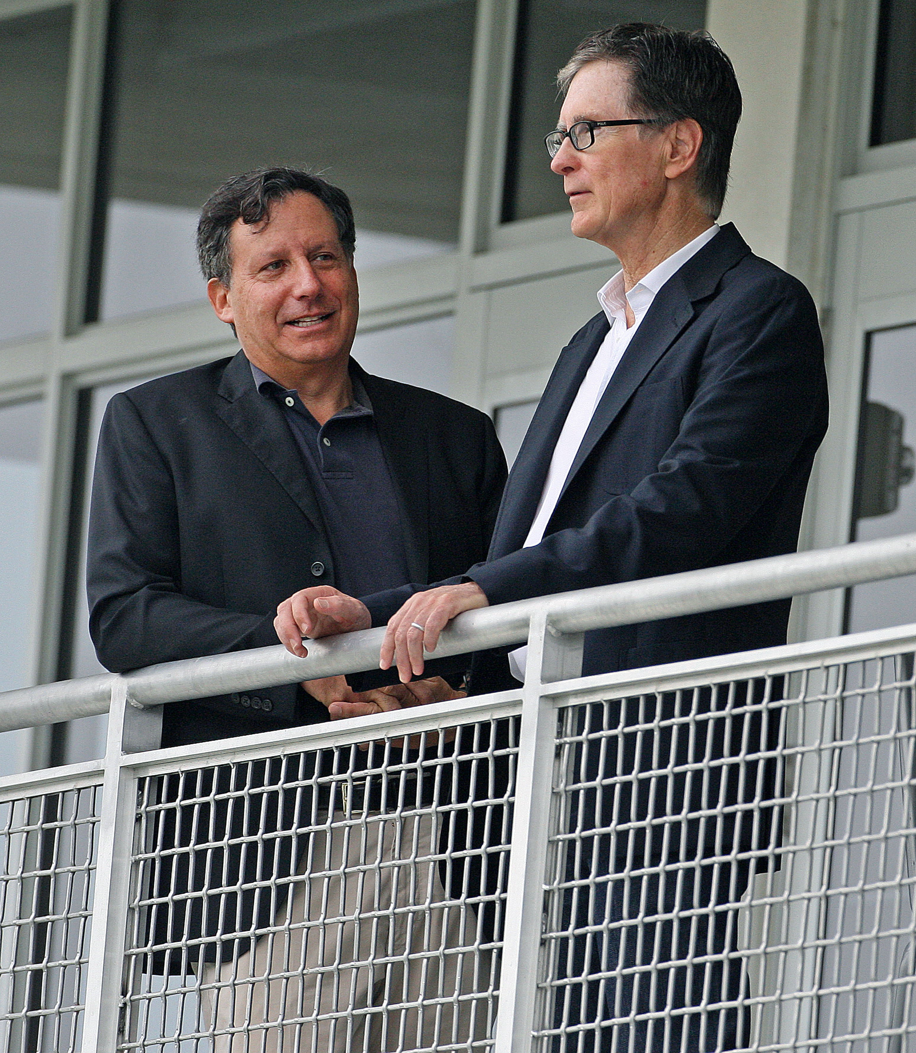 Red Sox owner John Henry said he and chairman Tom Werner (left) are determined to see the team get back on track in 2015.