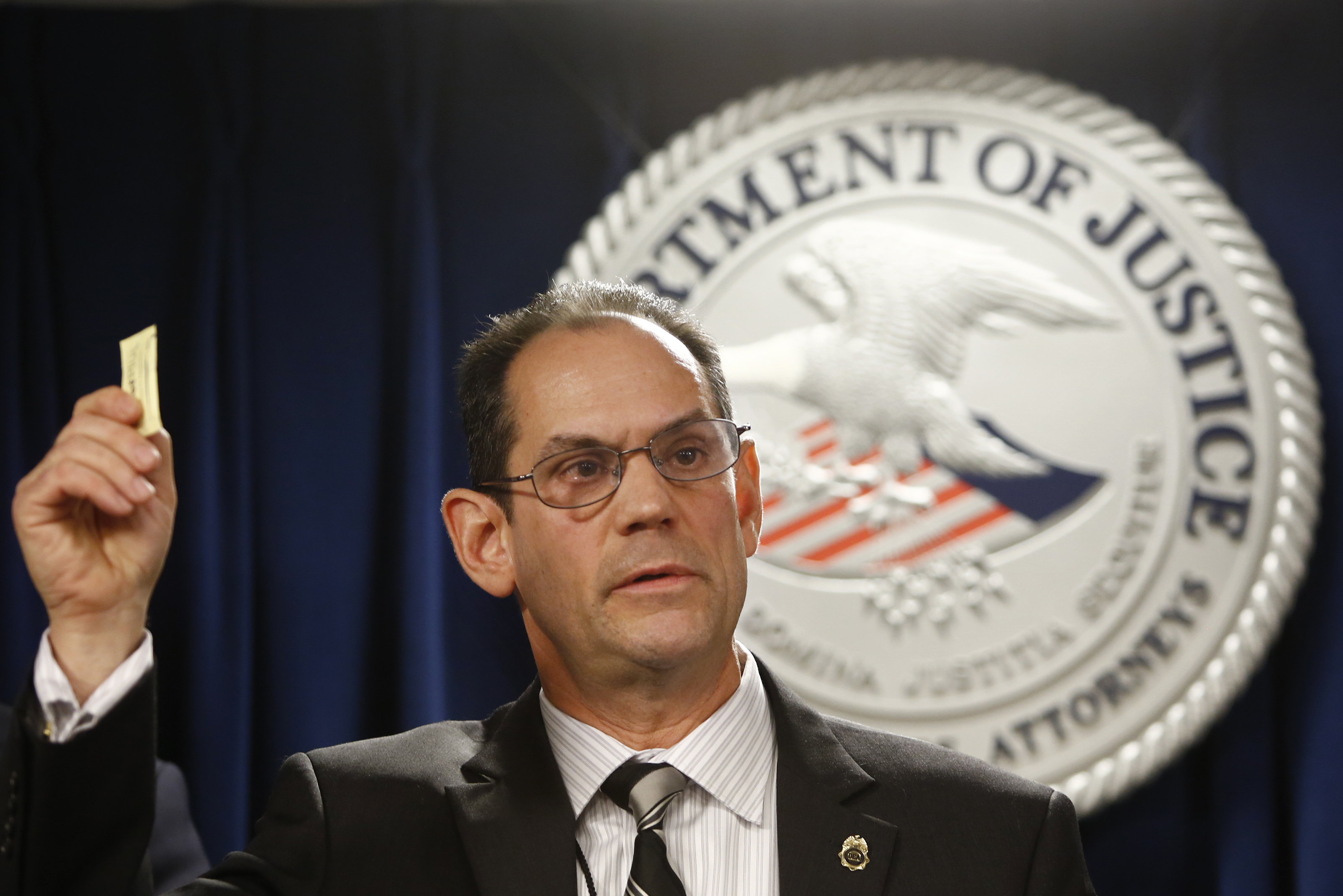 Michael Ferguson, a DEA special agent, held up a packet of sweetener to demonstrate the size of a lethal fentanyl dose.