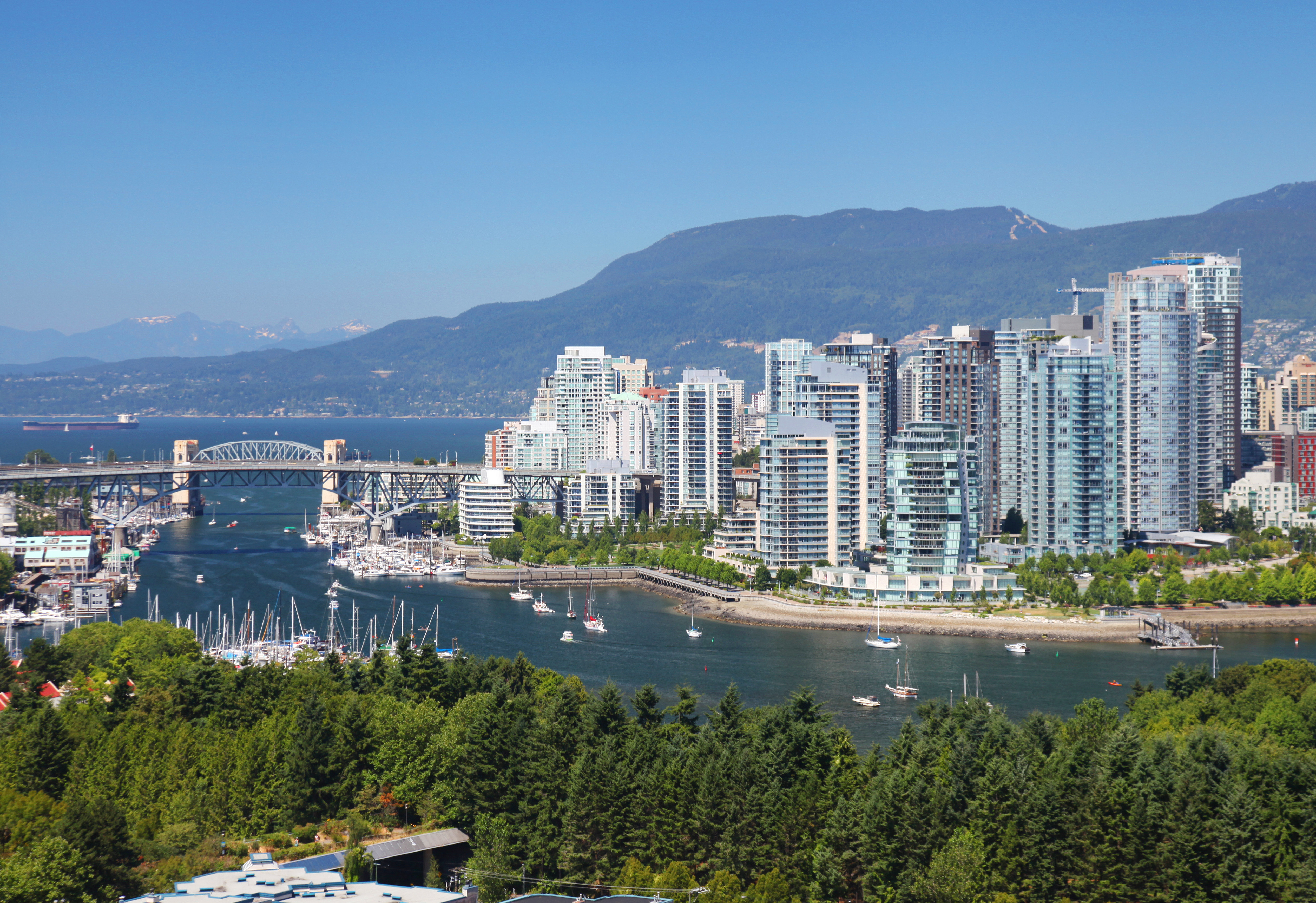 In Greater Boston, a median-priced single-family home is 7 times the median household income; in Vancouver (shown above), it’s into the double digits.