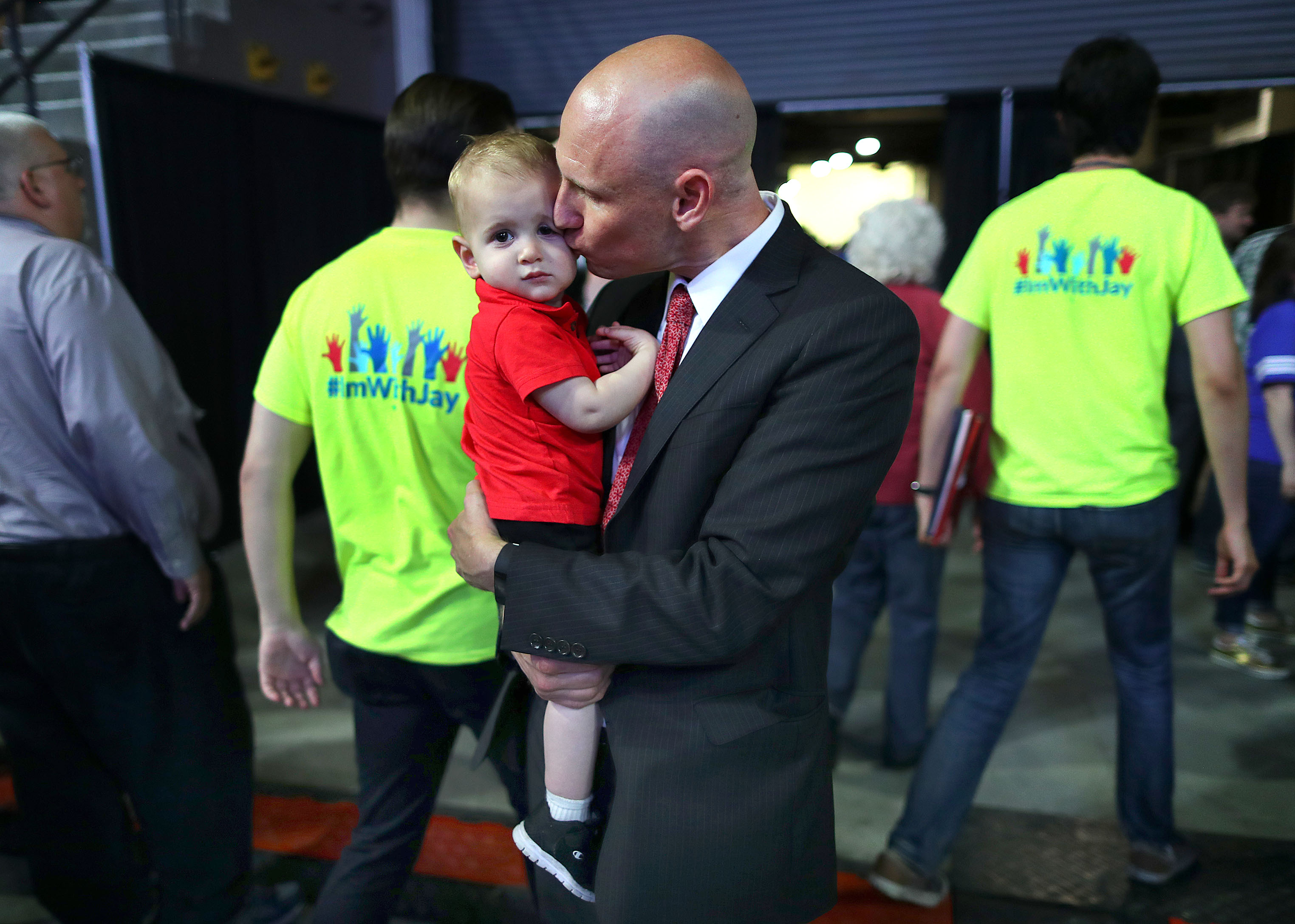Quentin Palfrey gave his son Max a kiss as he waited in a hallway for the ballots to be counted.