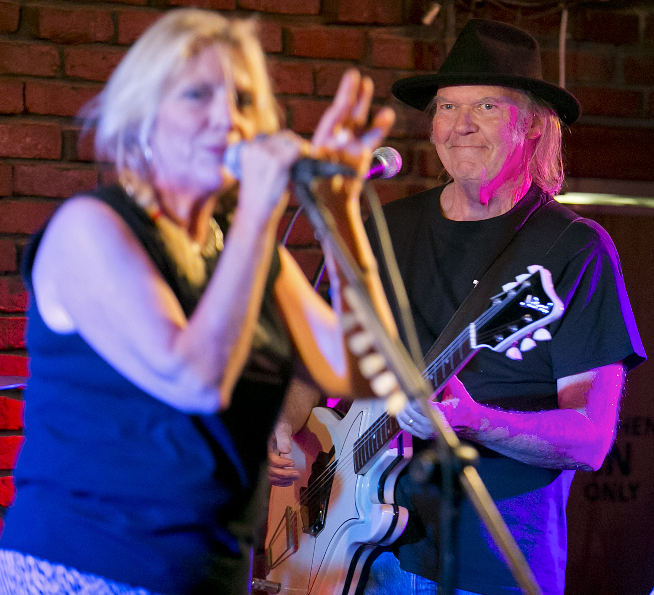 Neil Young, right, joined his wife Pegi on stage at Johnny D's in Somerville Wednesday night.