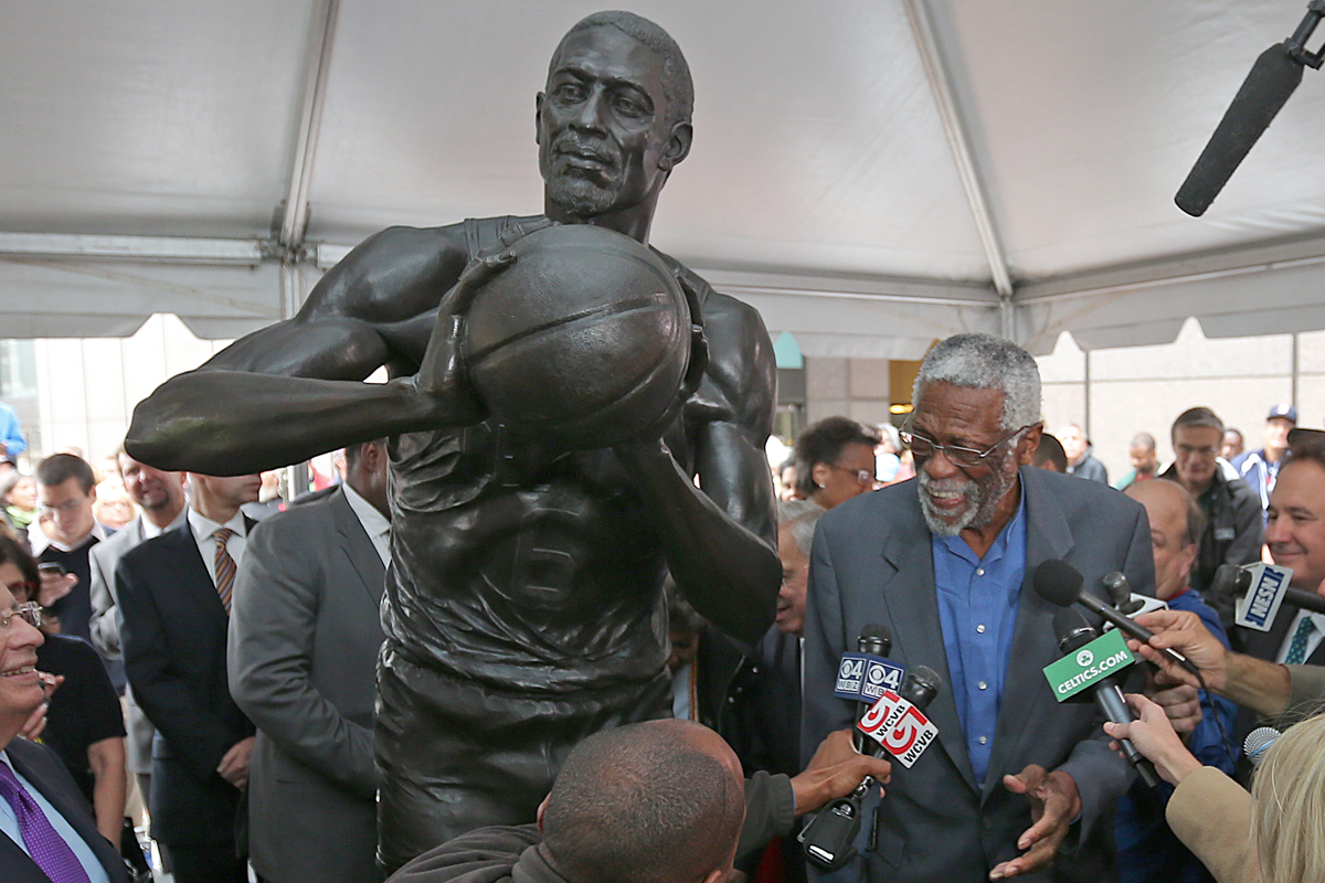 Boston Celtics Hall-of-Famer Bill Russell was surrounded by former teammates and others Friday as his statue was unveiled on City Hall Plaza.