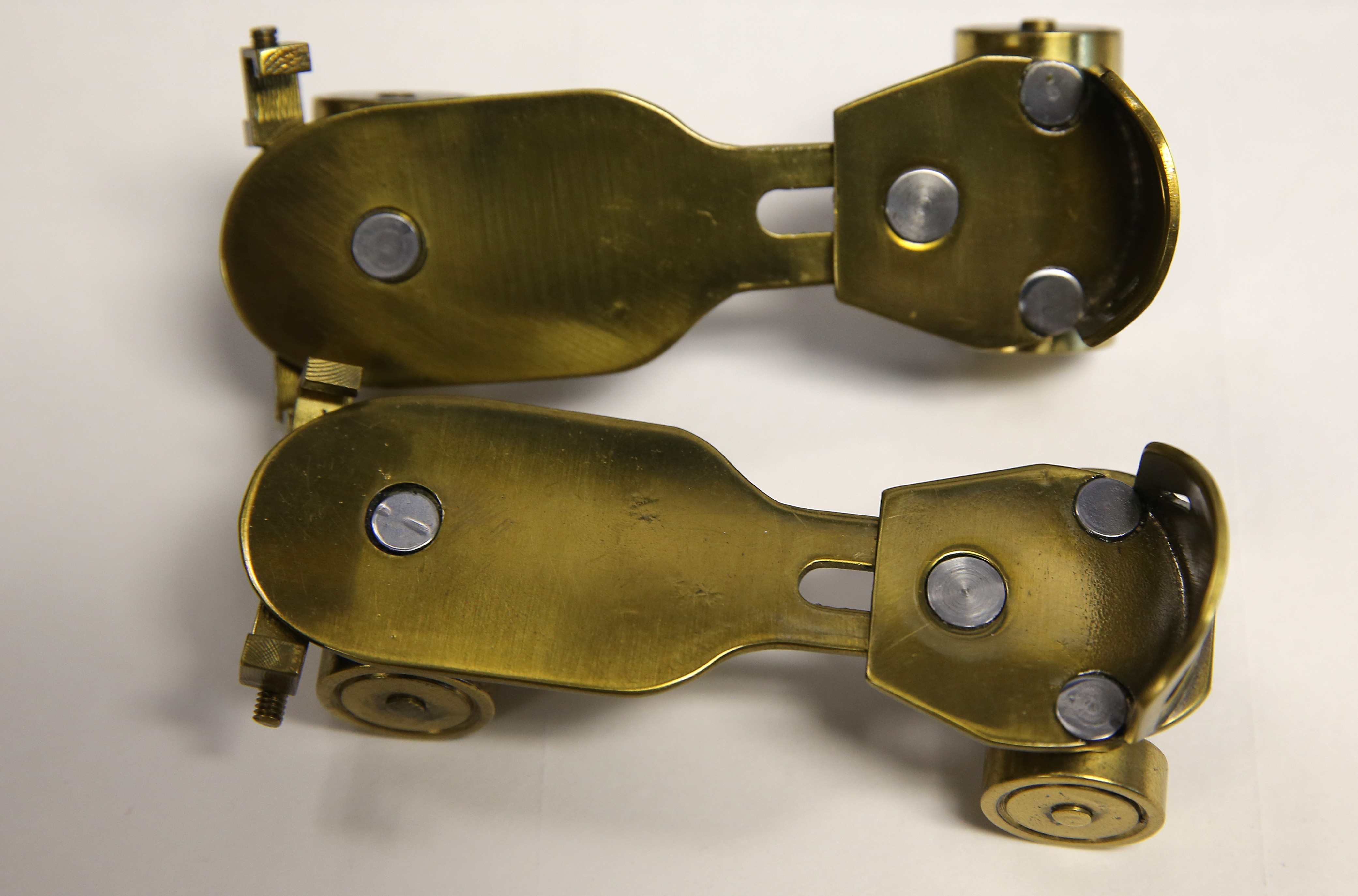 Miniature brass roller skates made by Abraham Megerdichian, a machinist and artist whose tiny metal toys are receiving new attention.