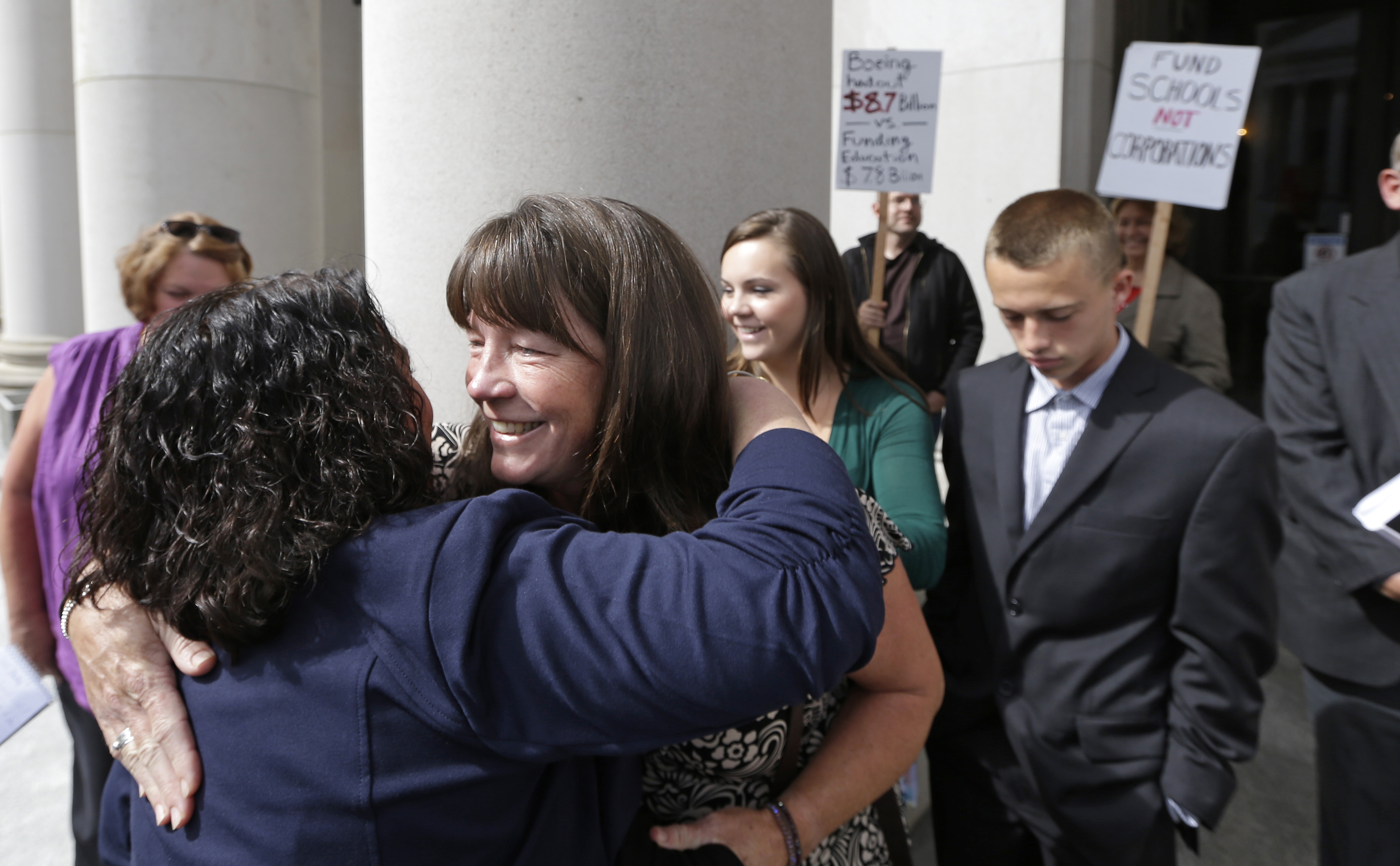 Stephanie McCleary was embraced outside the state Supreme Court.