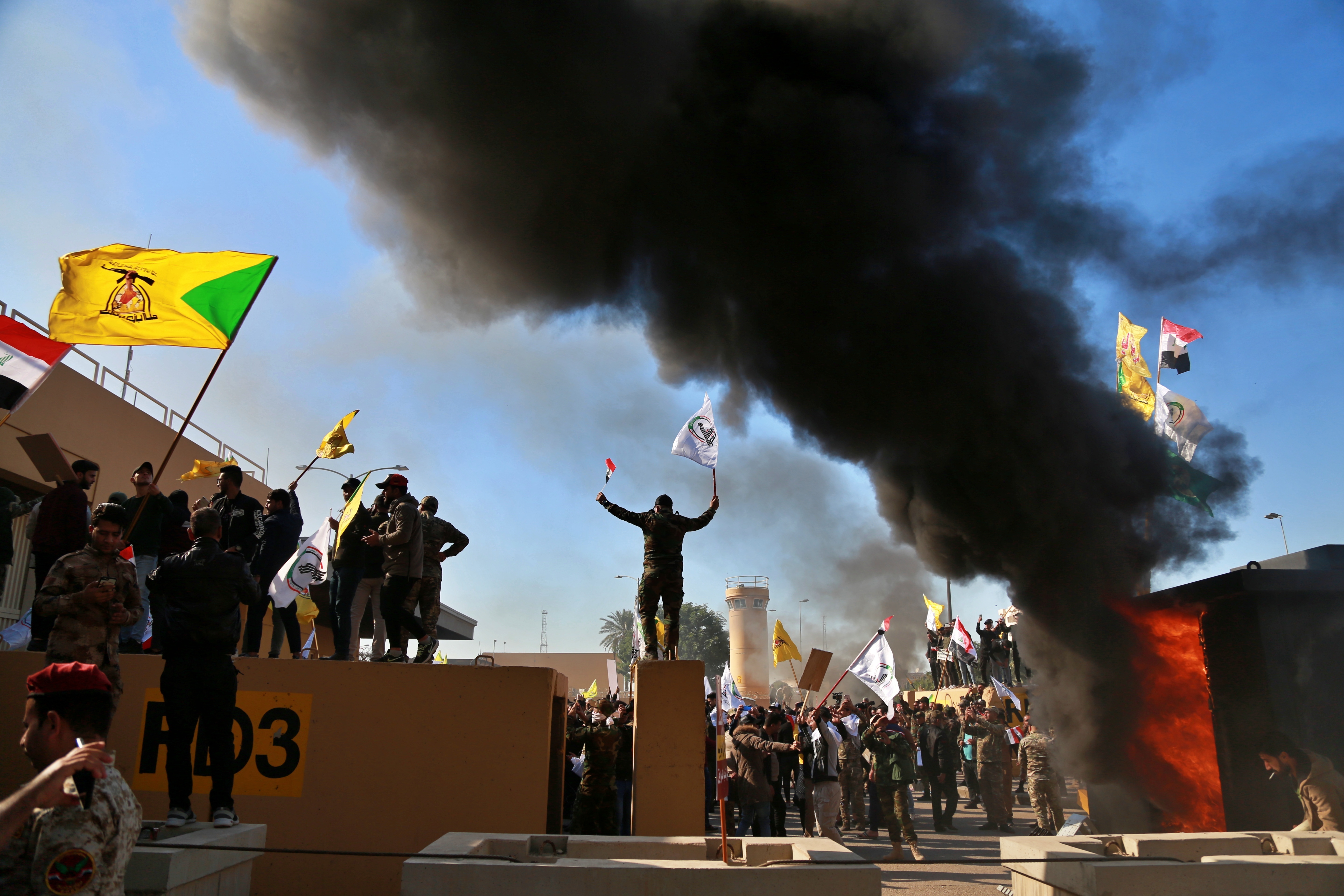 Protesters burned property in front of the US embassy compound, in Baghdad, Iraq.