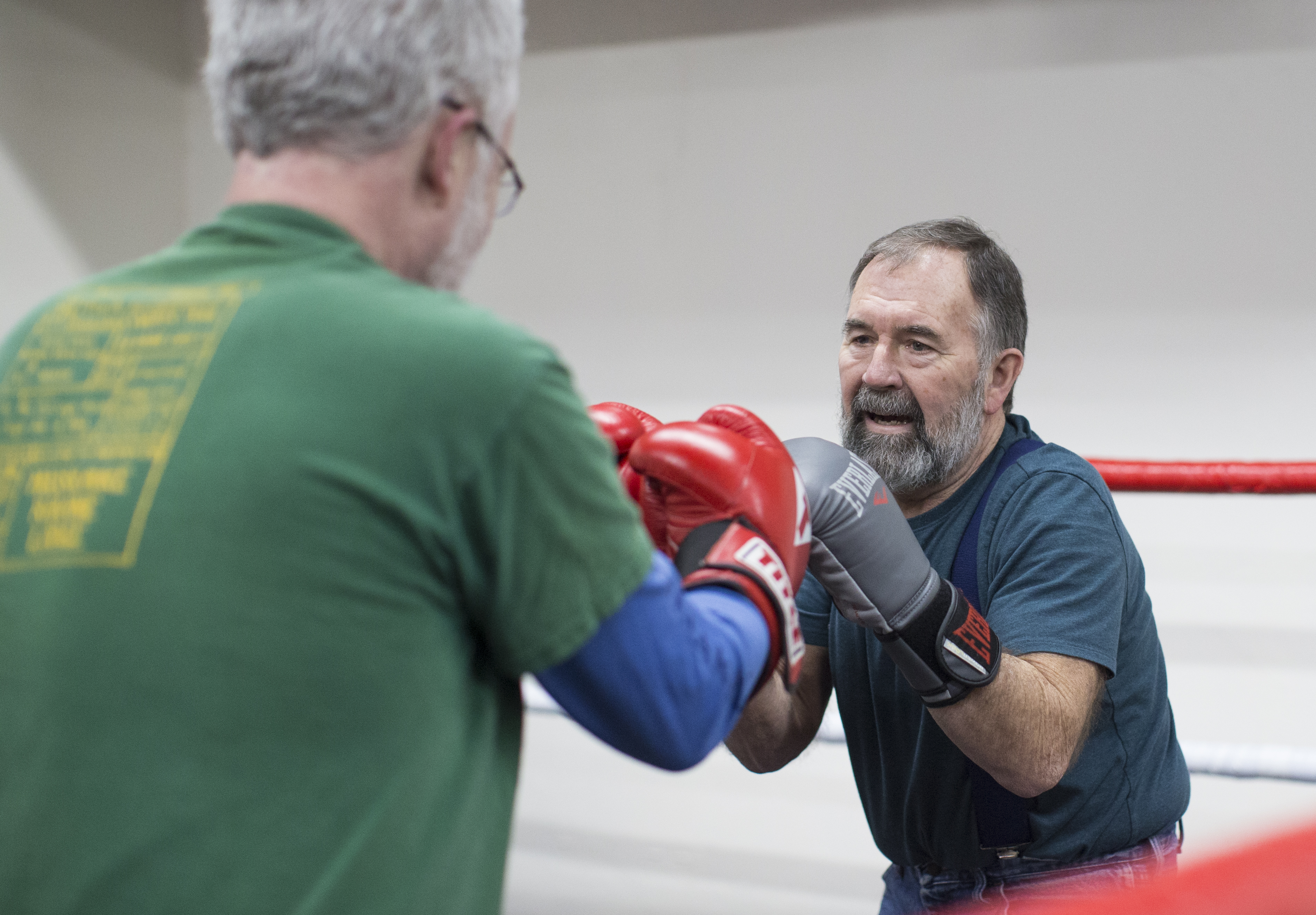Allen Young (right) spars with Richard Colby during a boxing class at the Salem Fitness Center.