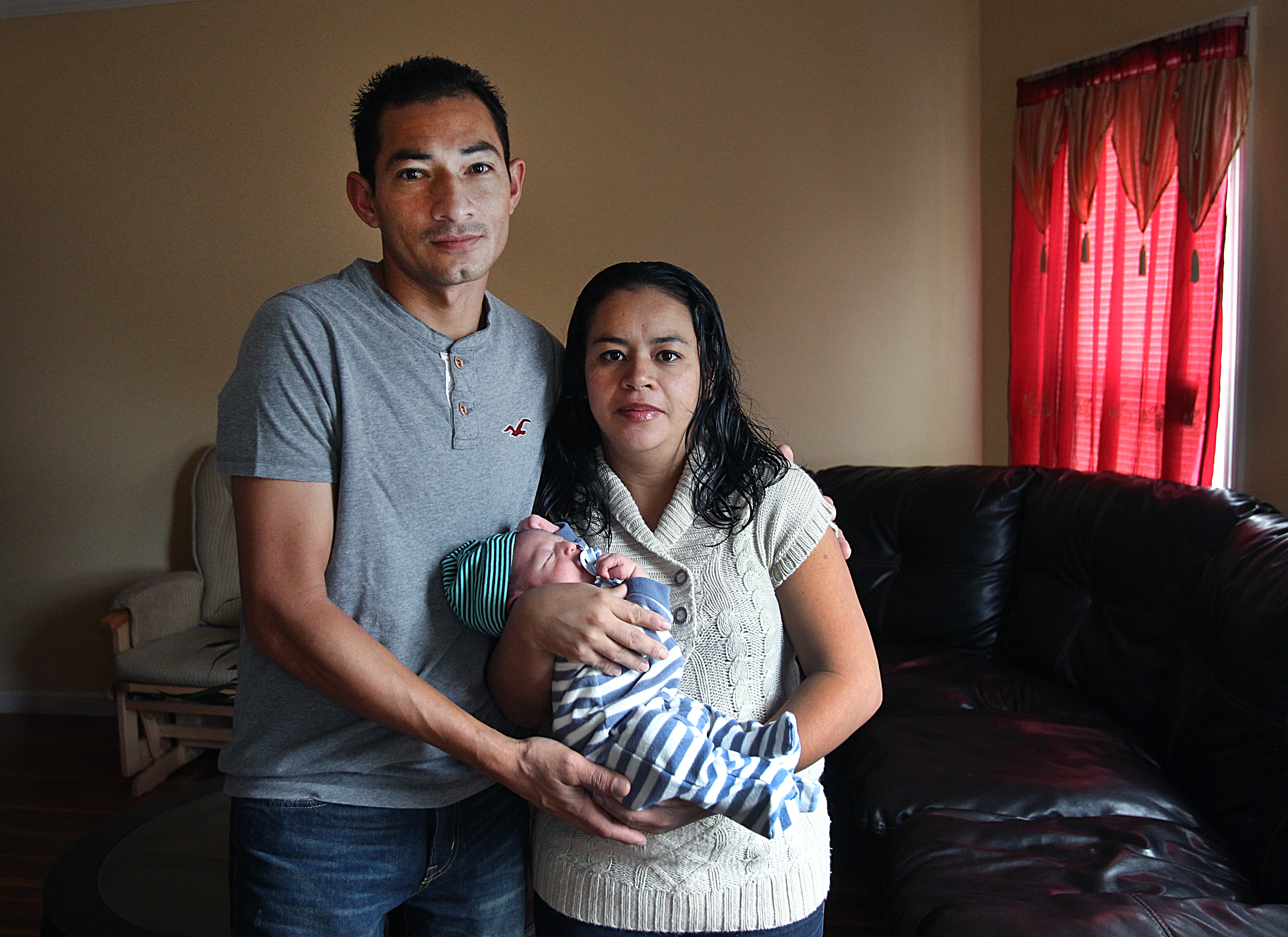 Moises Herrera, here with his wife, Mirna, and newborn son, David, fled El Salvador because of poverty and fear of gangs.