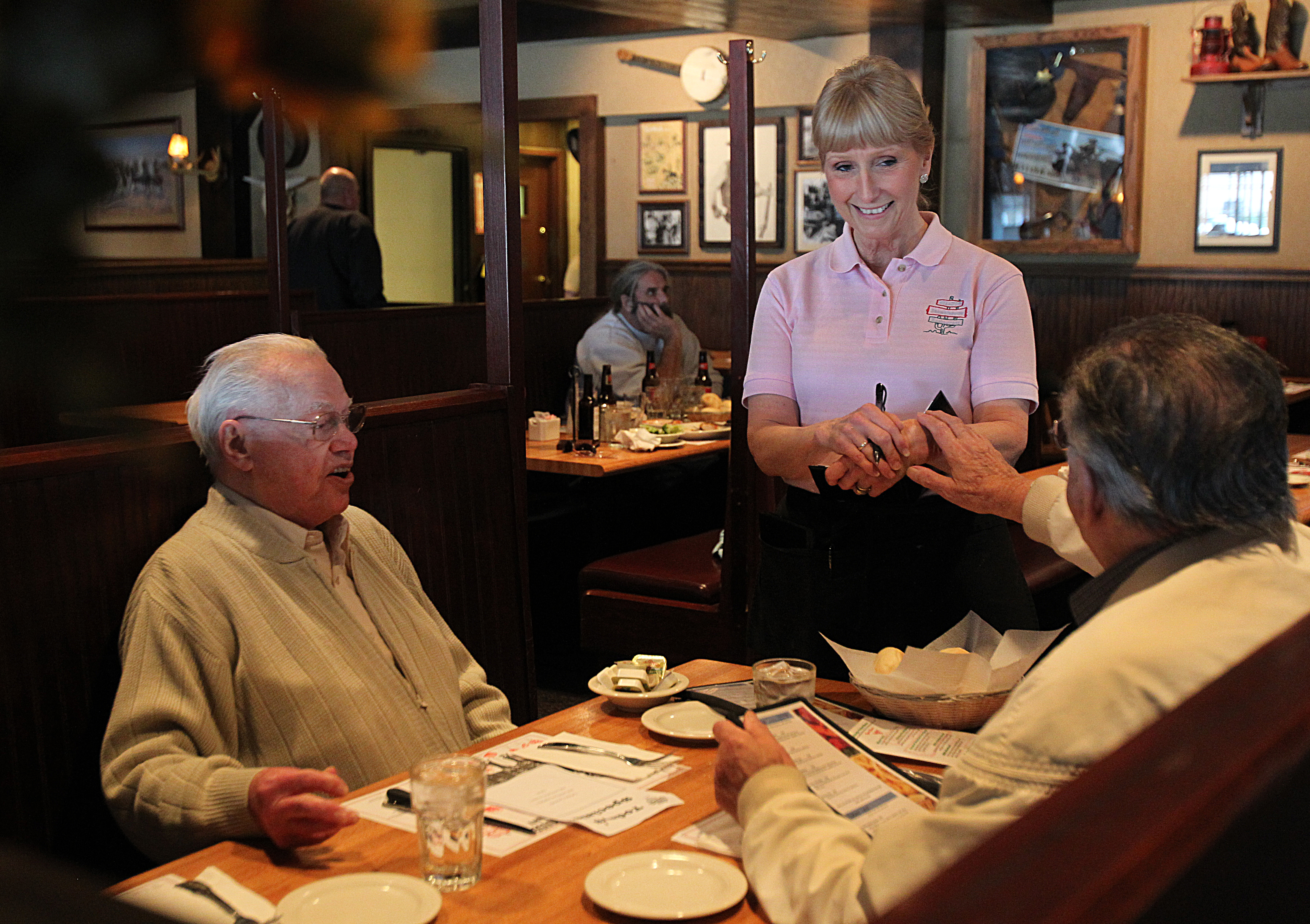 Susan Henderson, a Hilltop waitress for 35 years, served Tony Bruno of Revere (left) and Peter Mastrangelo of Everett.