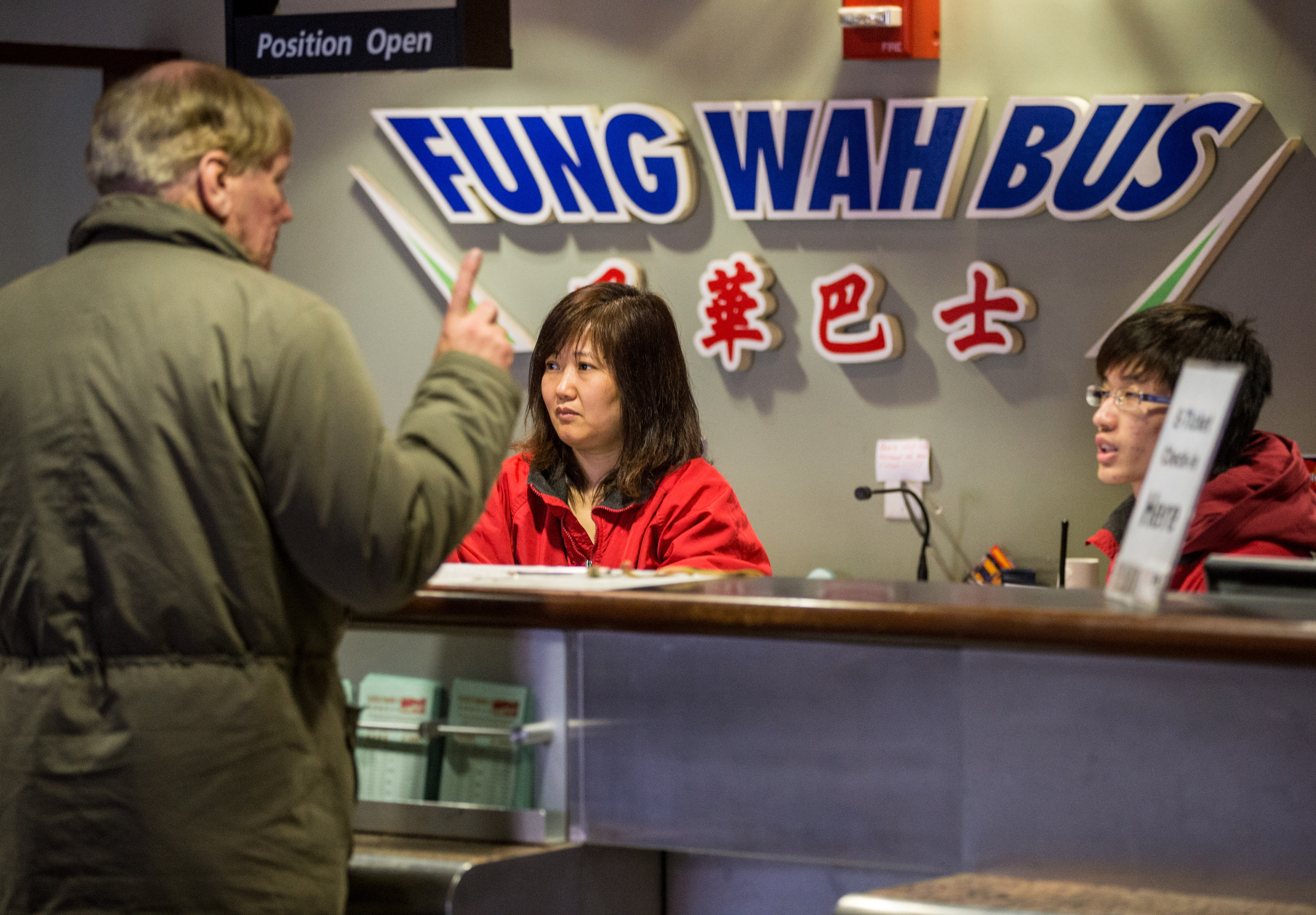 A worker at the Fung Wah counter at South Station sold tickets on Feb. 26, 2013.