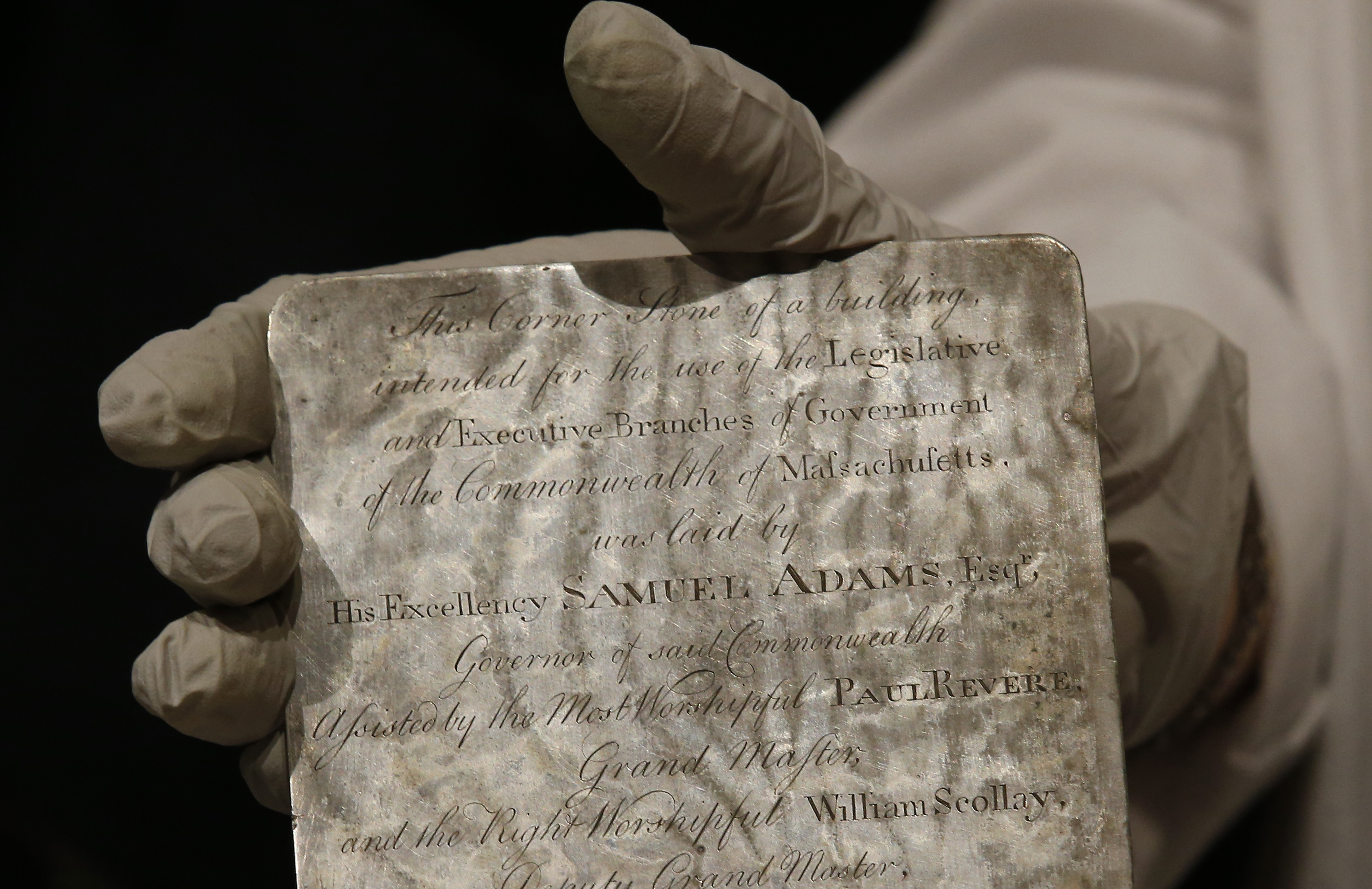 Pam Hatchfield, a conservator at the Museum of Fine Arts, held a silver plaque that was inside the time capsule.