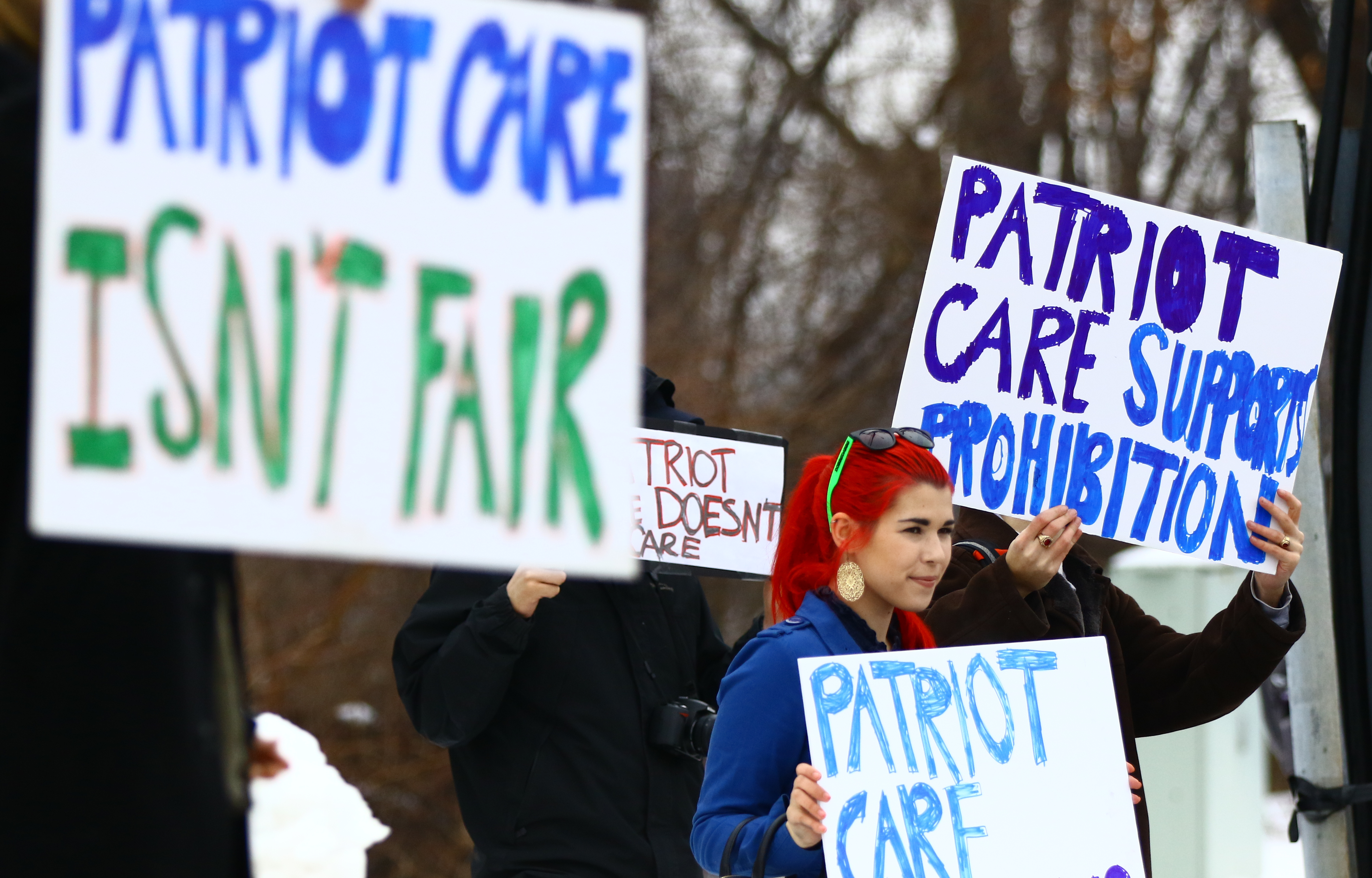 Brianna Morrell, a marijuana medical patient, protested outside of the Patriot Care medical marijuana dispensary in Lowell Tuesday — some fear the industry is trying to create a marijuana monopoly.