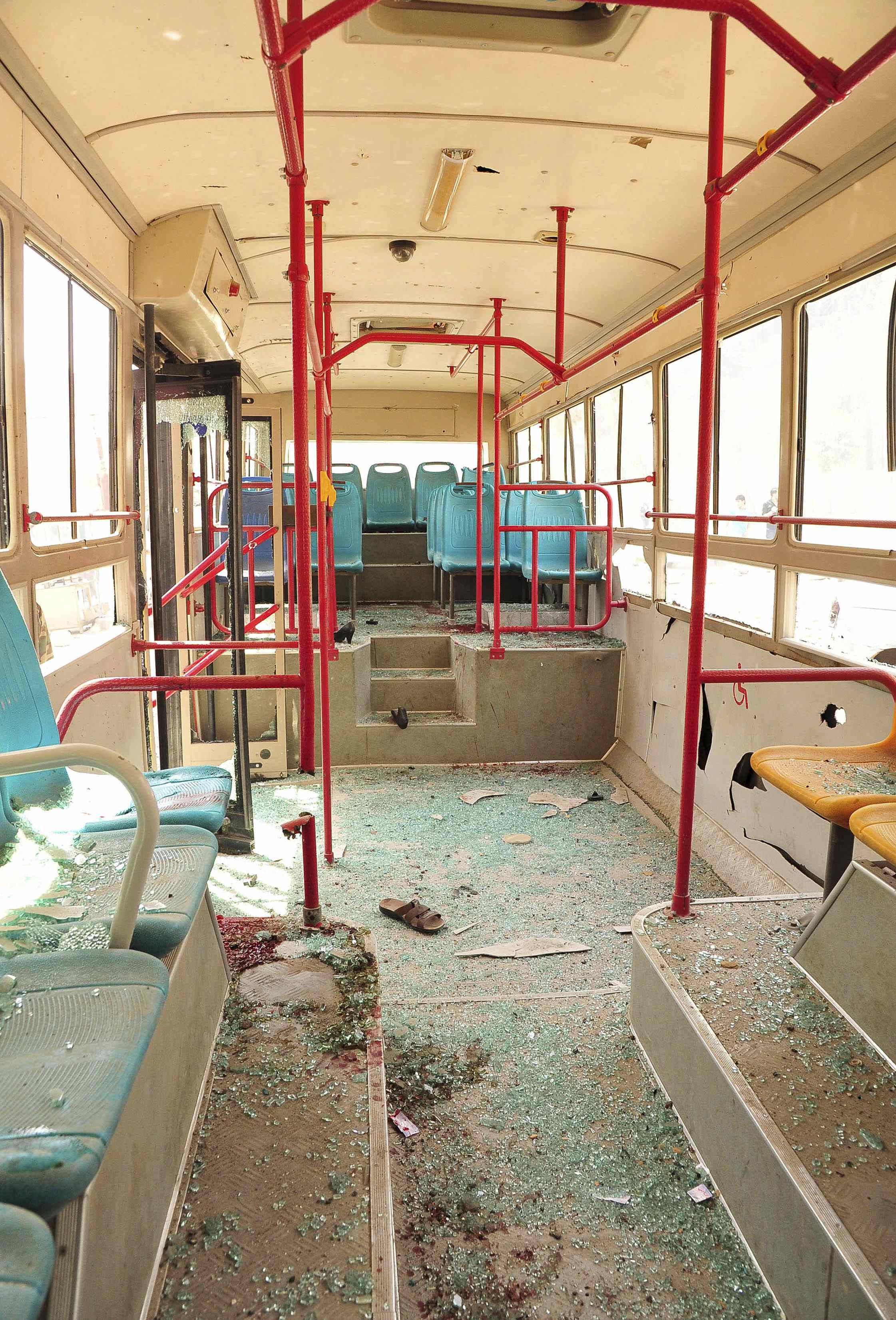 Syrian activists said a bus was damaged in Raqqa Province on Friday in shelling by President Bashar Assad’s forces.