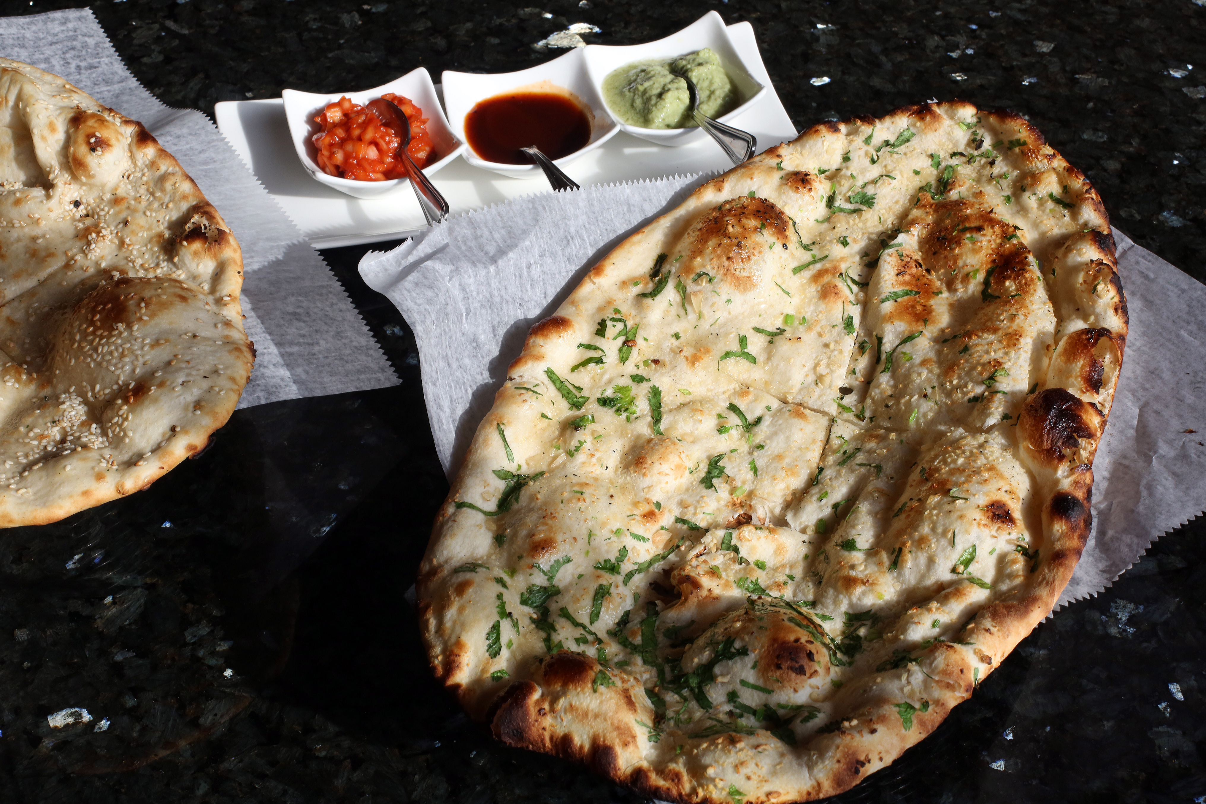 Naan with three condiments.
