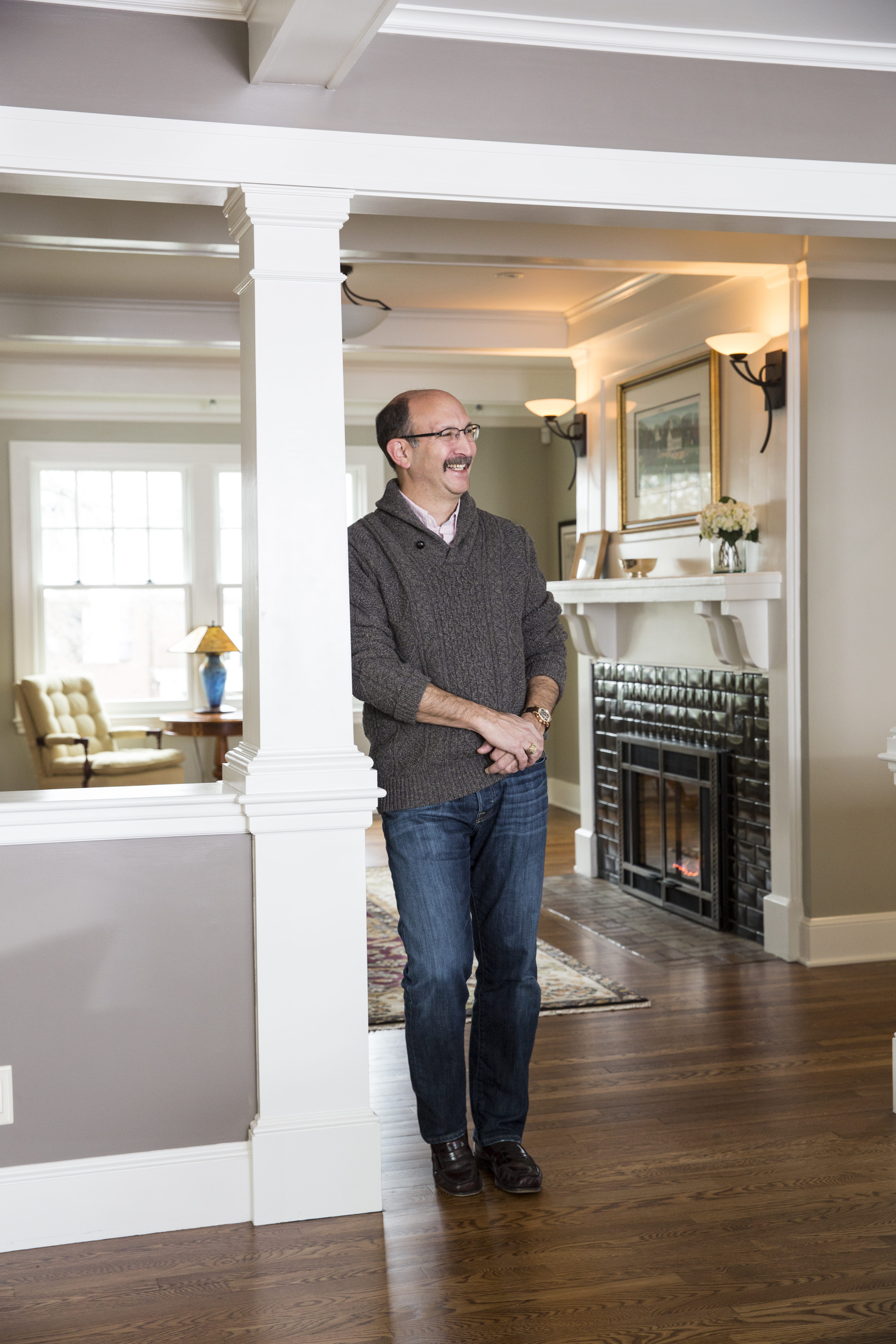 Steve Snider’s living room features a new gas fireplace with an Arts and Crafts-style surround and the original mantel.
