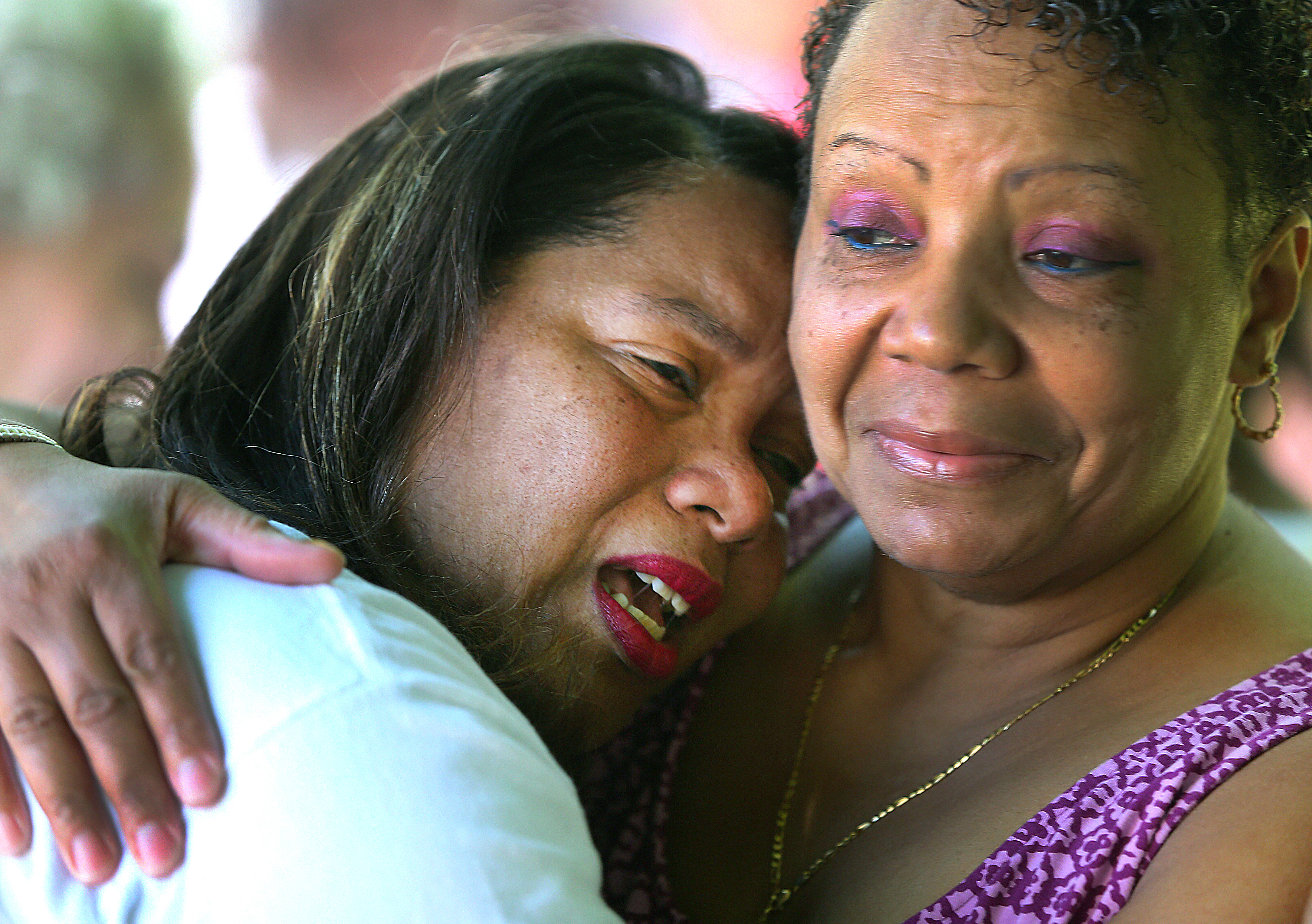Kim Odom wept on the shoulder of her friend Joyce Neale as the Steven Odom Tranquility Garden in Dorchester was dedicated to the memory of her son. The Odoms have become involved in antiviolence advocacy.