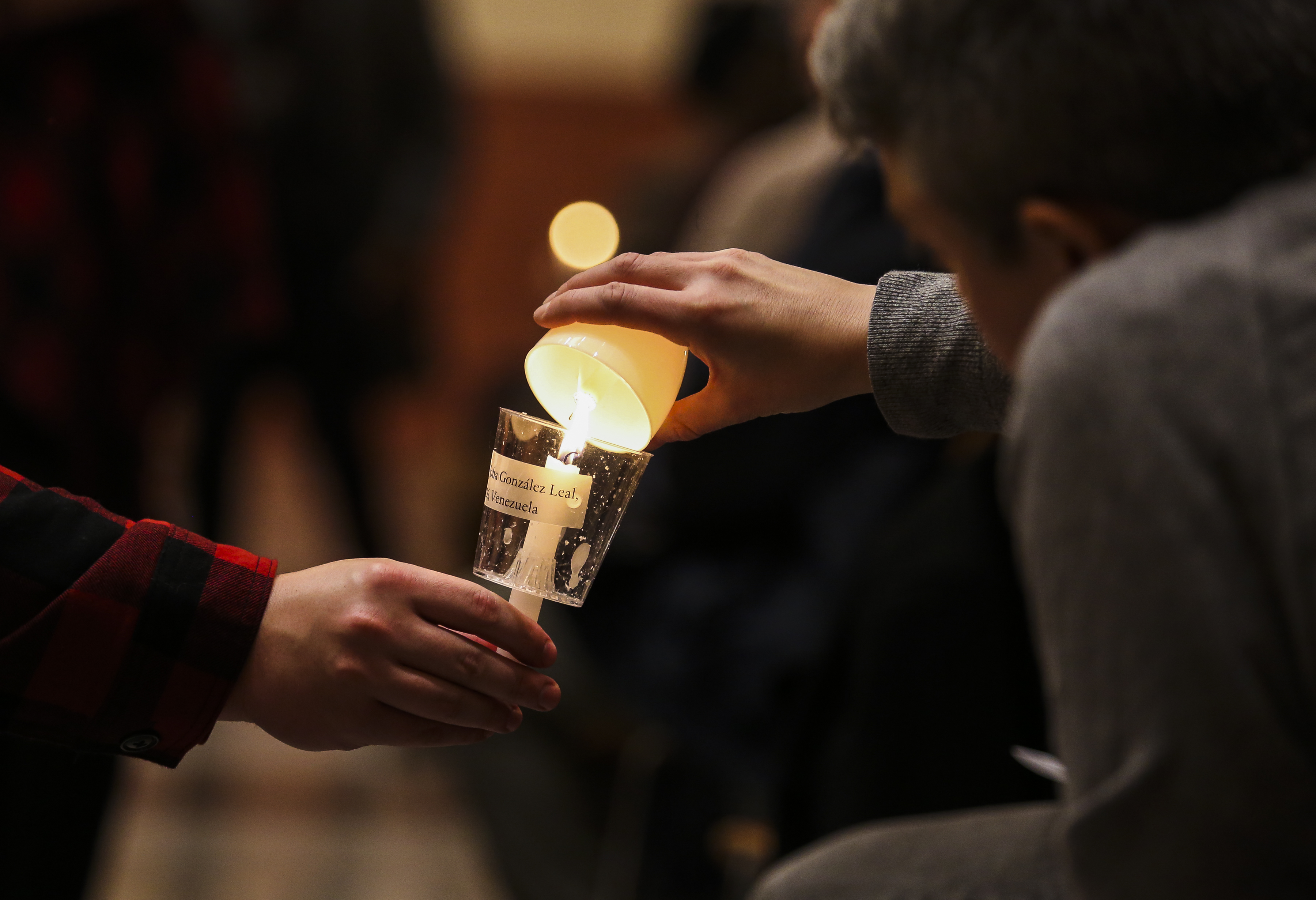 Audience members lit candles.
