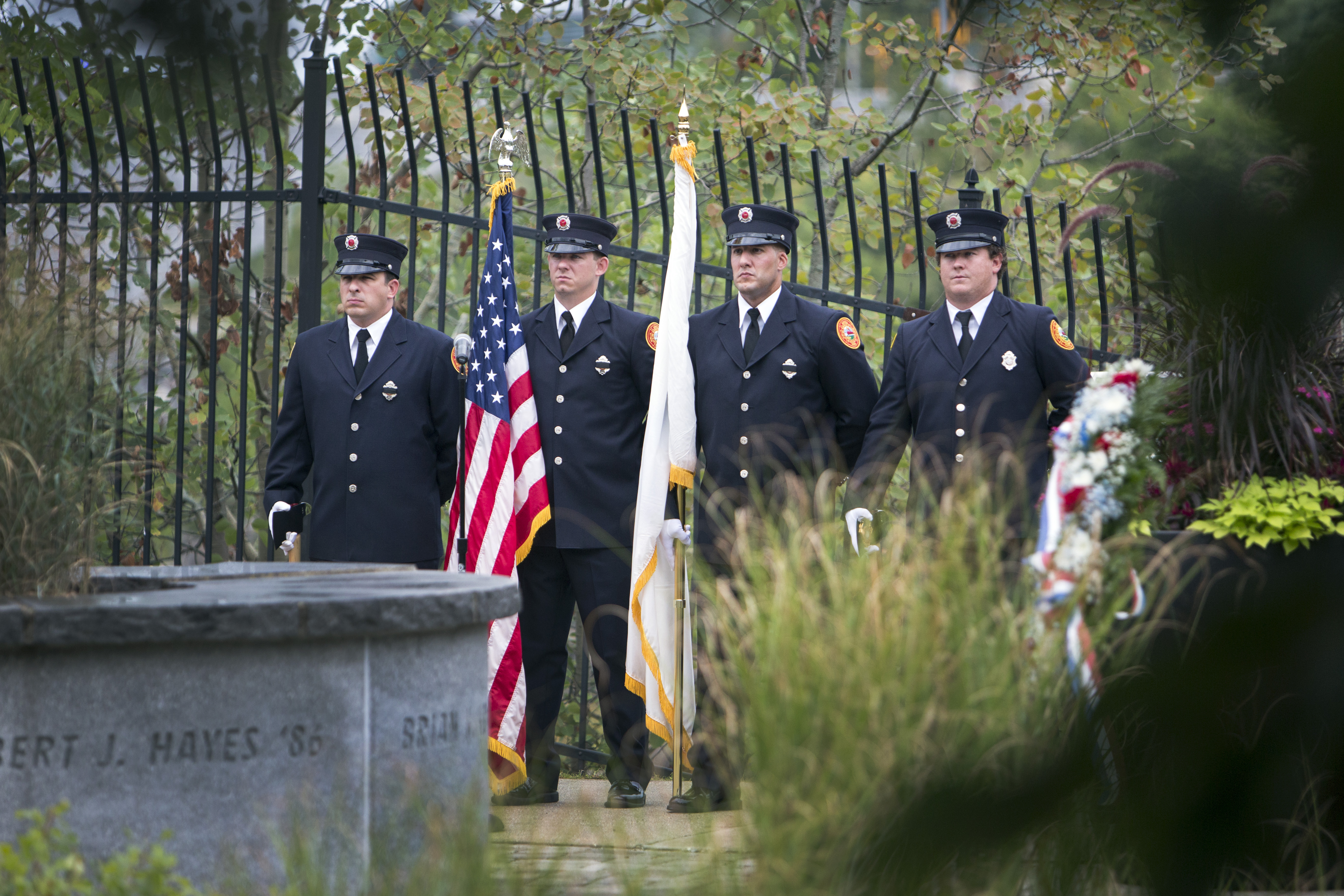 The Lowell Fire Department Honor Guard stood before the memorial during the ceremony.