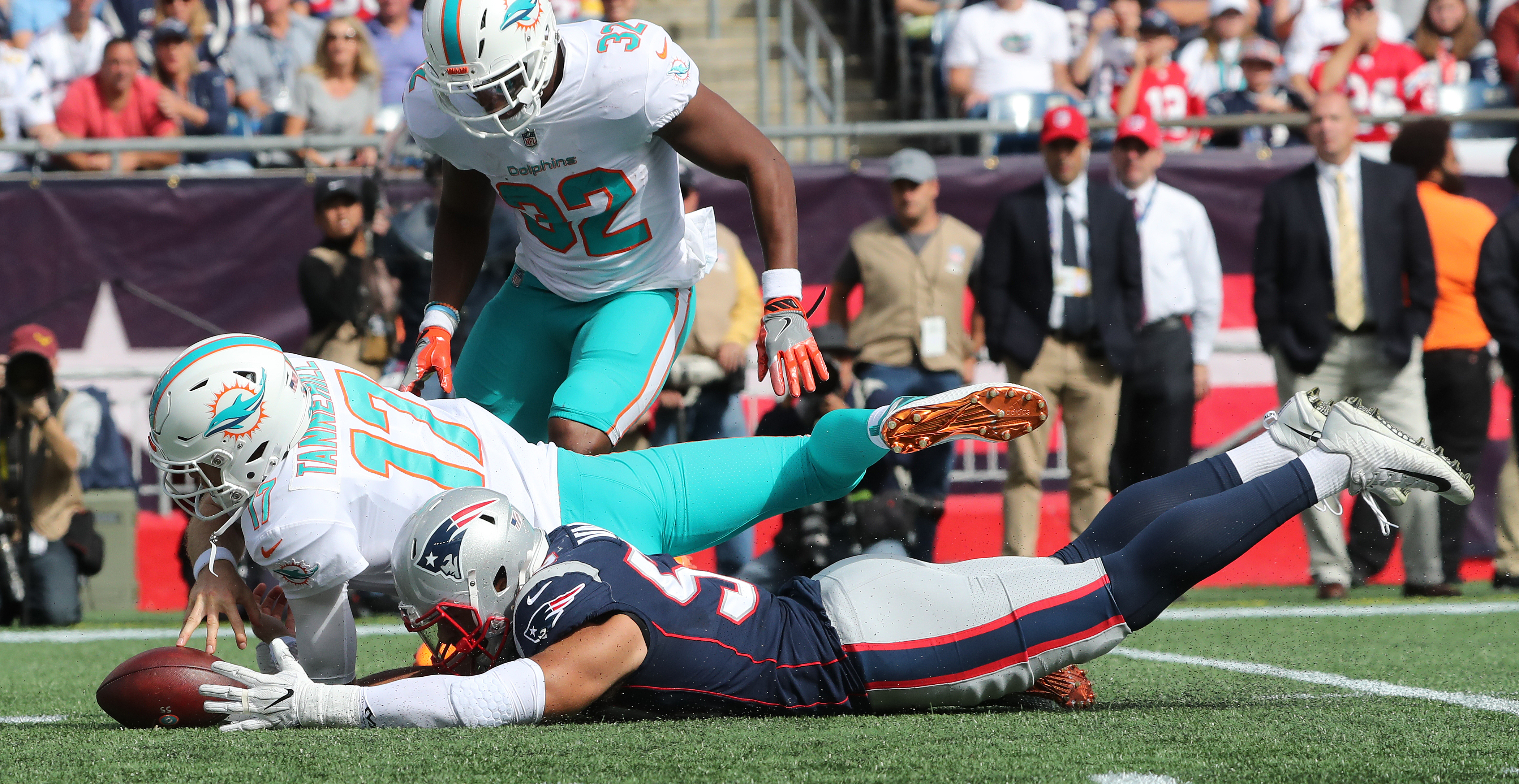 Kyle Van Noy recovers as fumble by Dolphins quarterback Ryan Tannehill in the second quarter.