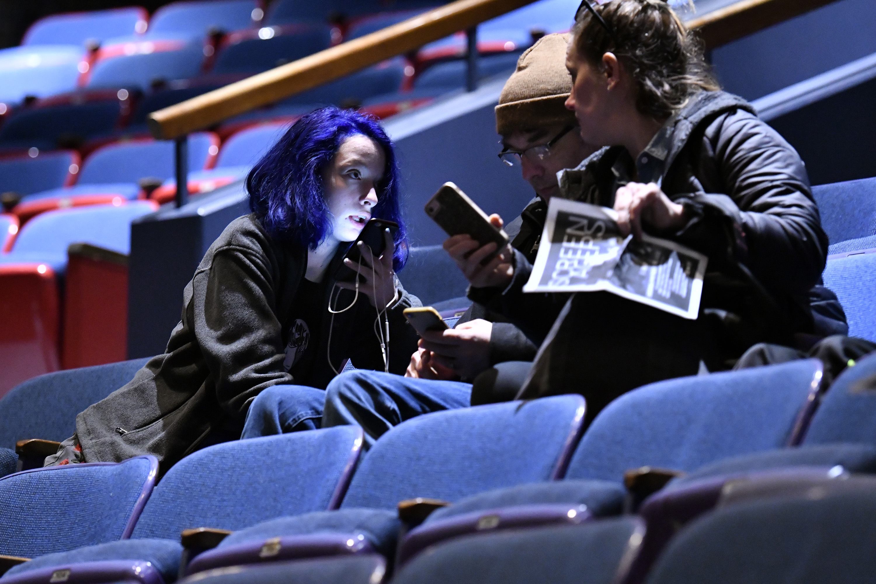 Evelyn Natale, 13, with her parents, Paul and Melissa, before the film and discussion.