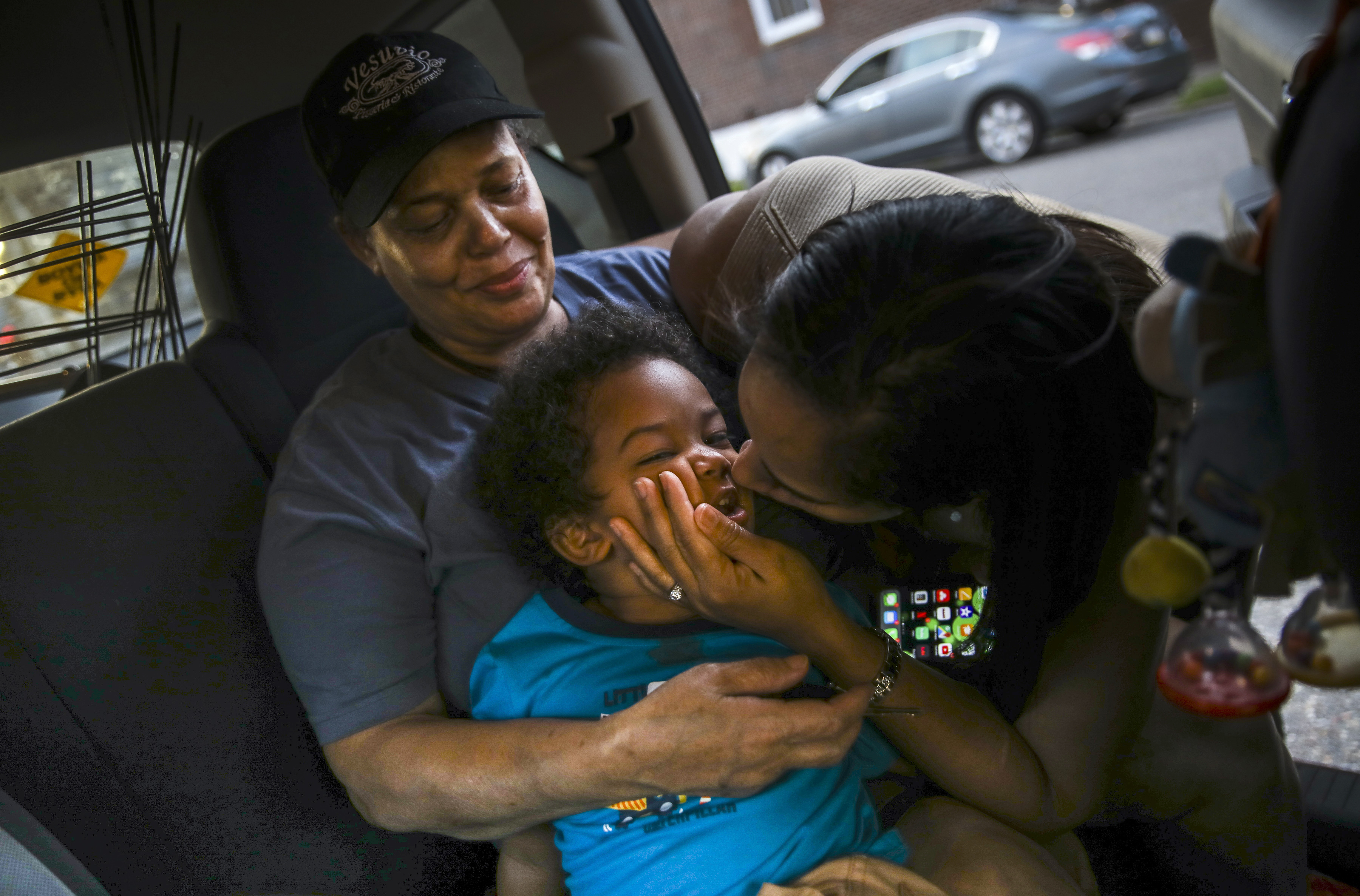Maria Mateo held her grandson Ian, while her daughter, Nicarol Soto, kissed her son's cheek while campaigning for Hazleton City Council. If elected, Soto will be the first Latino on the Hazleton council.
