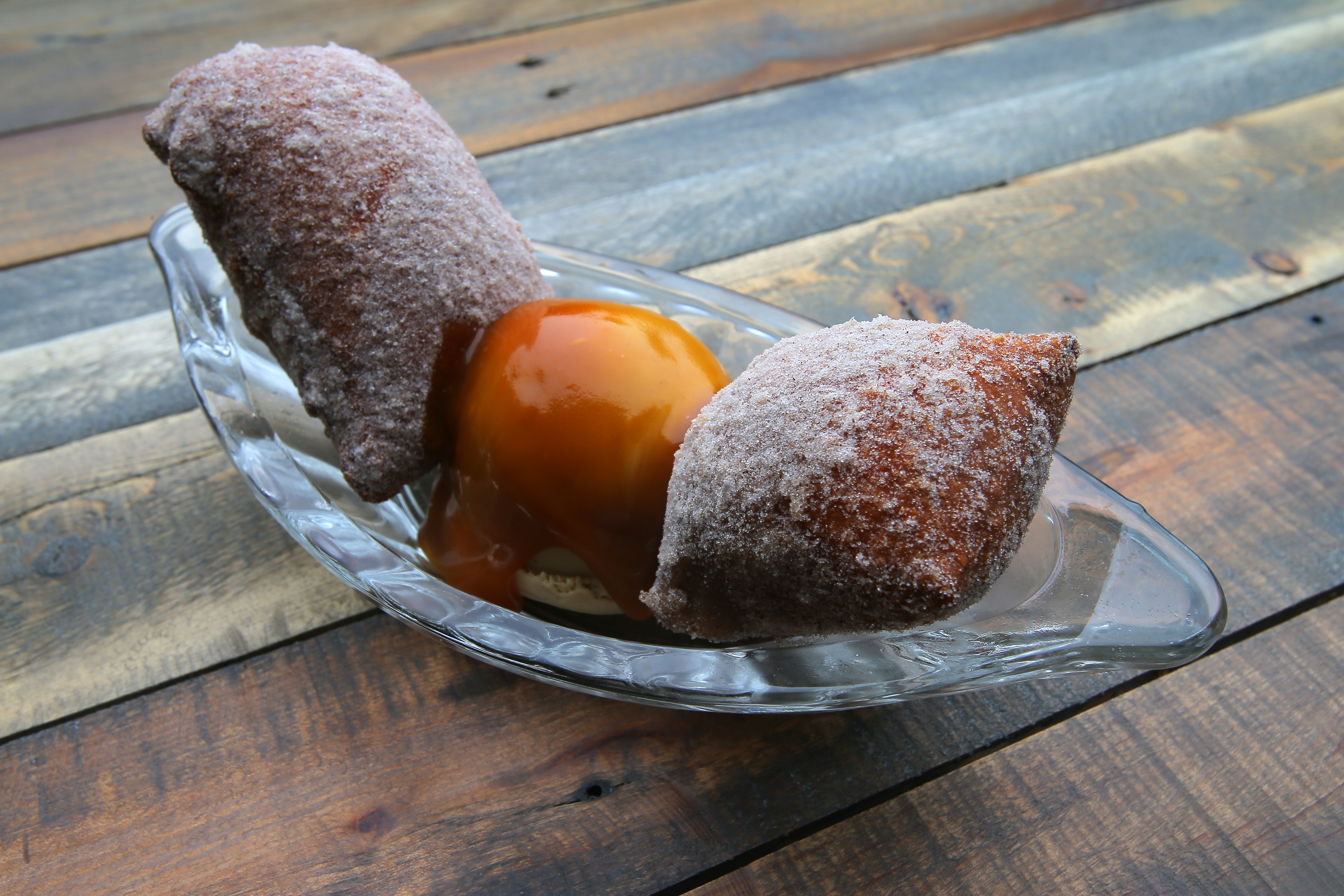 Apple doughnuts with ice cream and salted caramel.