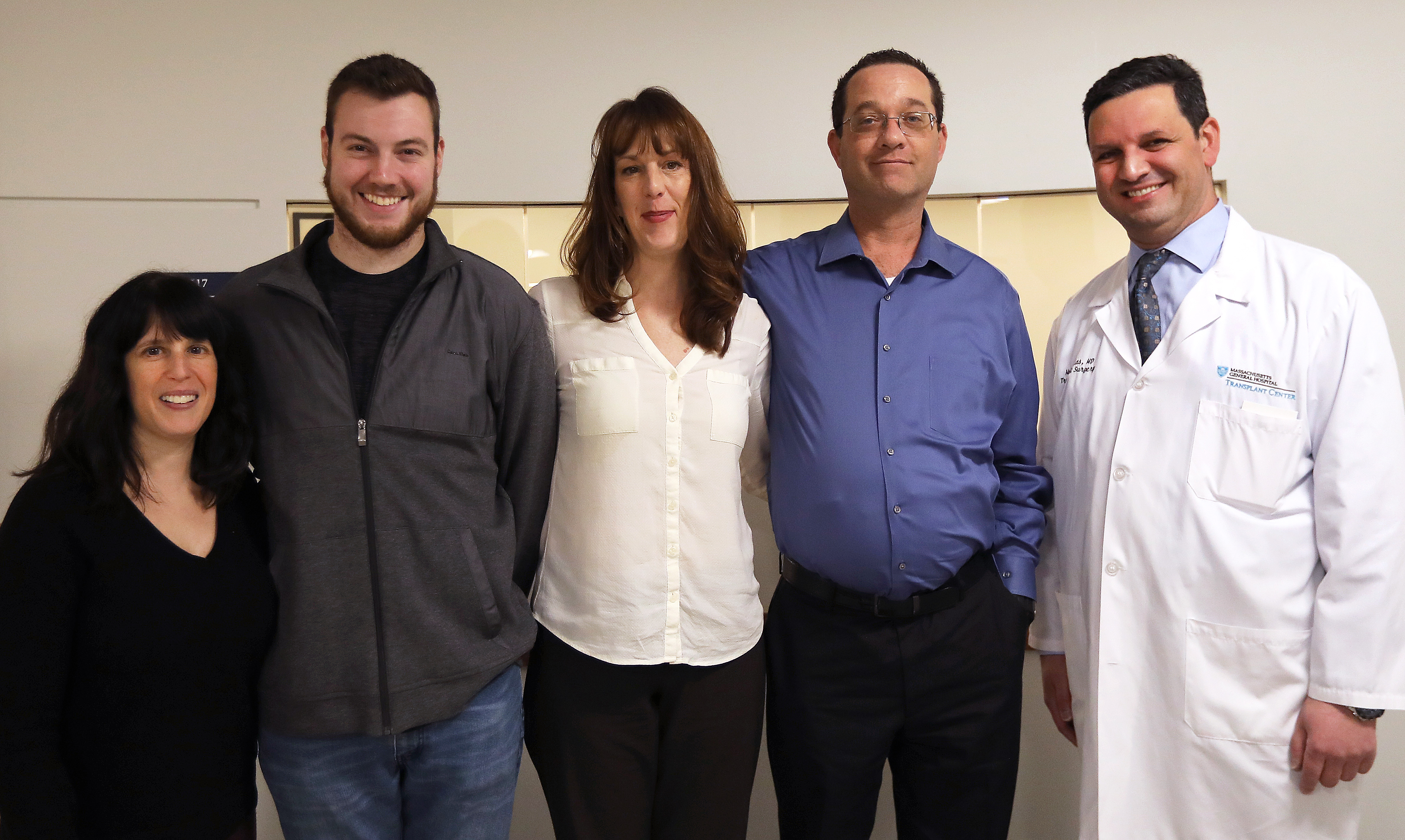 Melissa Cohen (left) flanks Christopher Cassidy, to whom she donated a kidney. Next to Cassidy is Erin Brunelle, who will donate a kidney so that Don Burl II, an extended family member, can move up the transplant list. At right is Dr. Nahel Elias, surgical director of renal transplants at MGH.