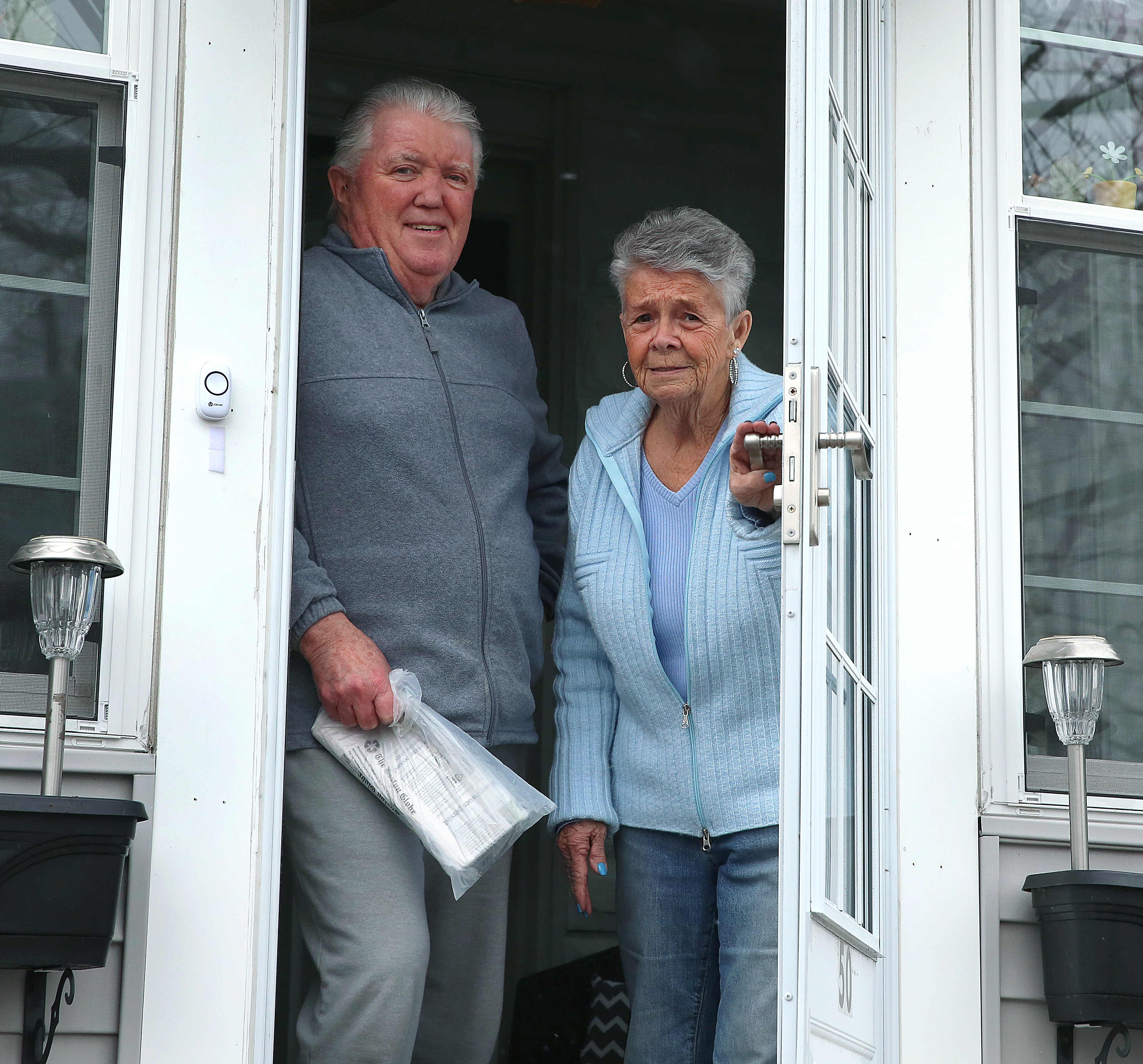 Jim and Brenda Leary of East Boston received their paper on Monday from driver Eliot Resnick.